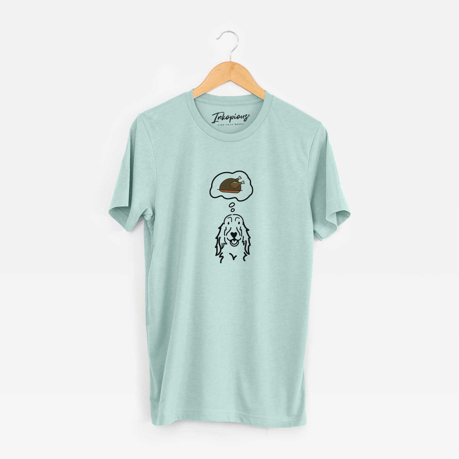 Minimalist line drawing of a Setter with a little turkey on a Heather Sage Unisex crewneck