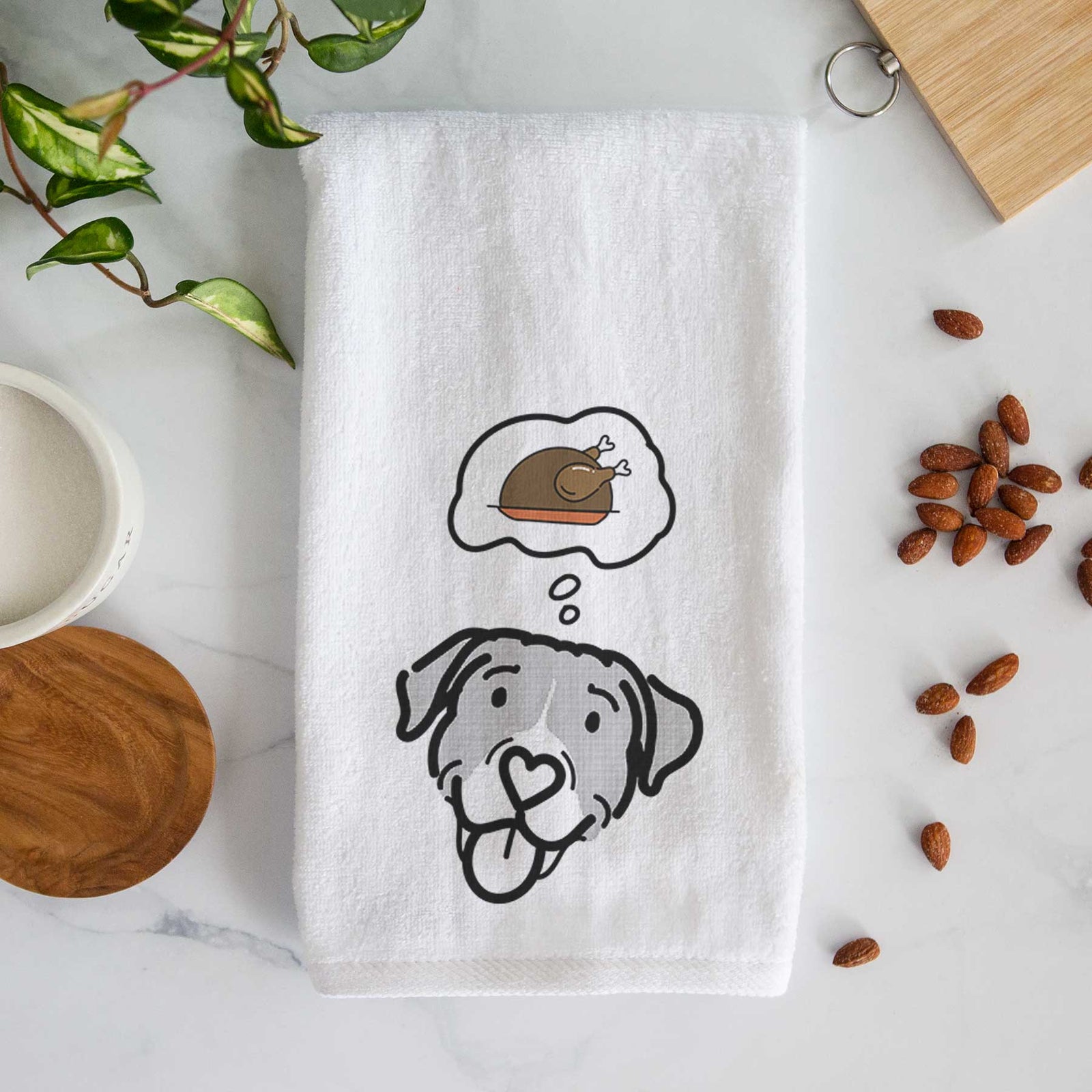 Minimalist line drawing of Shadow the Pitbull Mix with a little turkey on a decorative hand towel