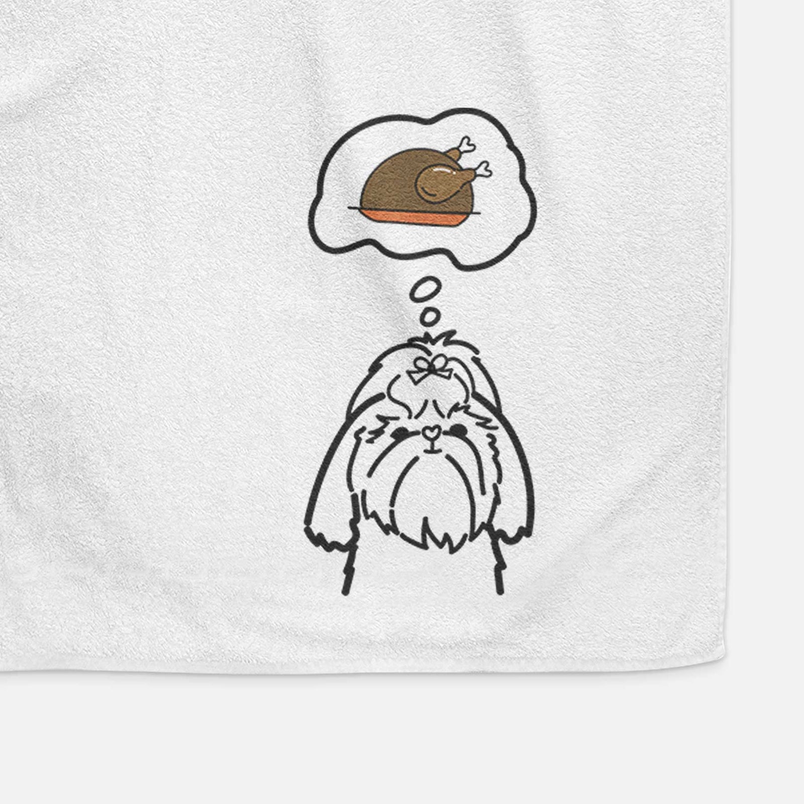 Minimalist line drawing of a Shih Tzu with a little turkey on a decorative hand towel