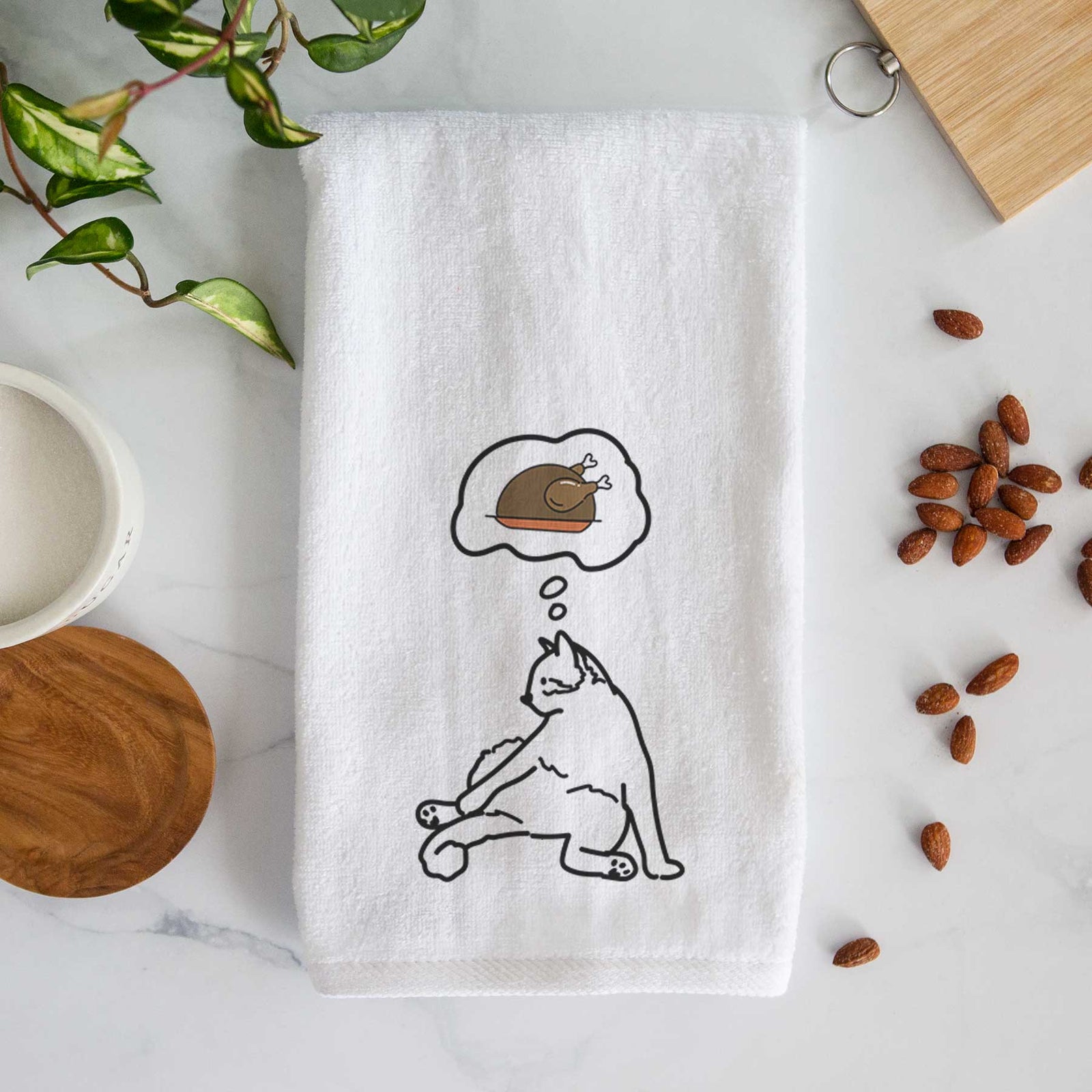 Minimalist line drawing of Tom the Cat with a little turkey on a decorative hand towel
