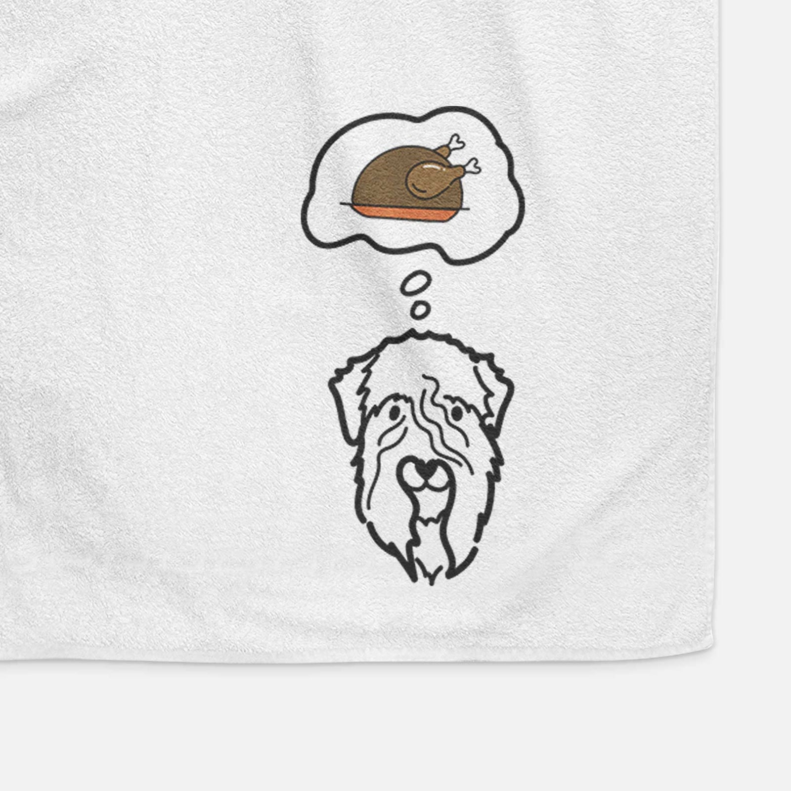 Minimalist line drawing of a Soft Coated Wheaten Terrier with a little turkey on a decorative hand towel