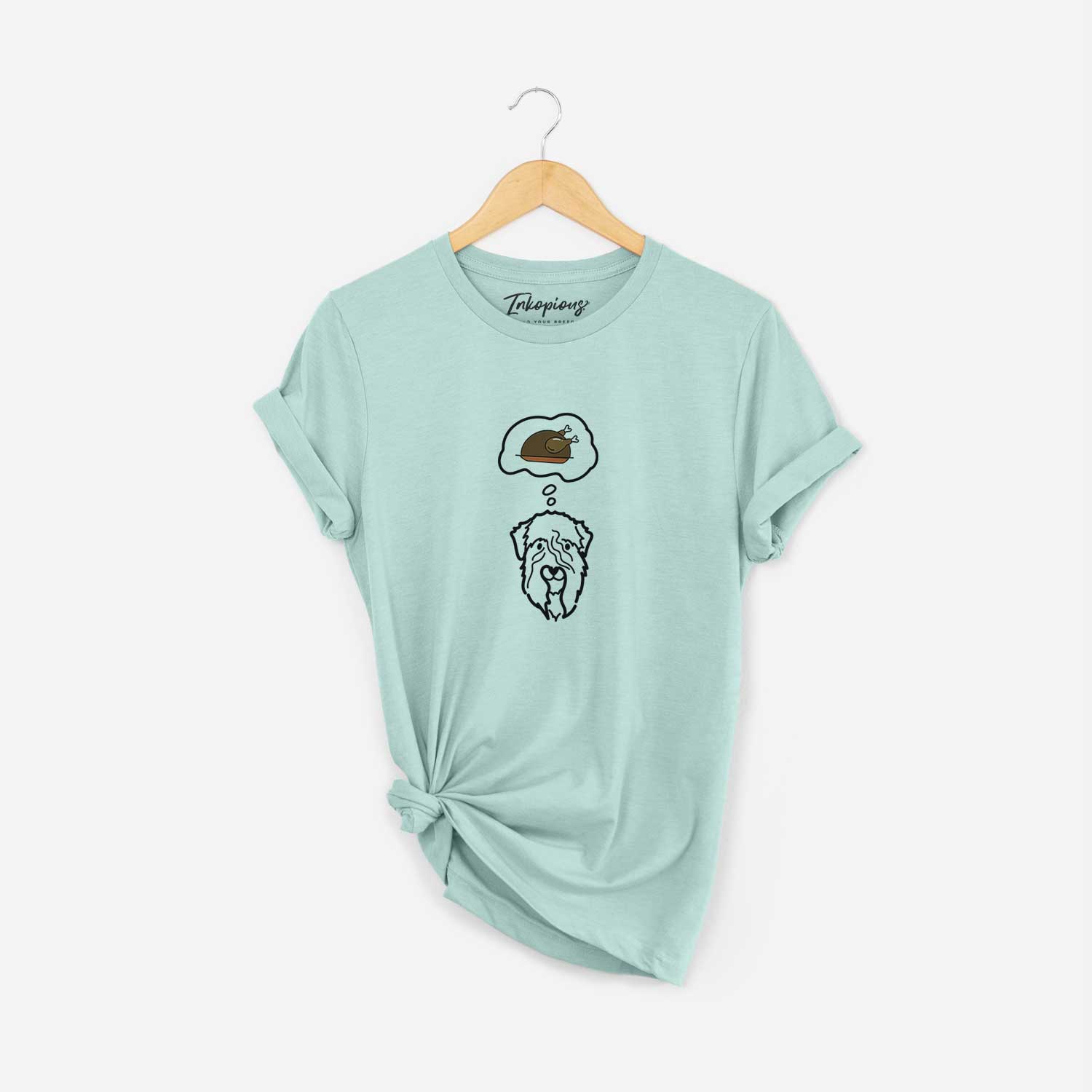 Minimalist line drawing of a Soft Coated Wheaten Terrier with a little turkey on a Heather Sage Unisex crewneck