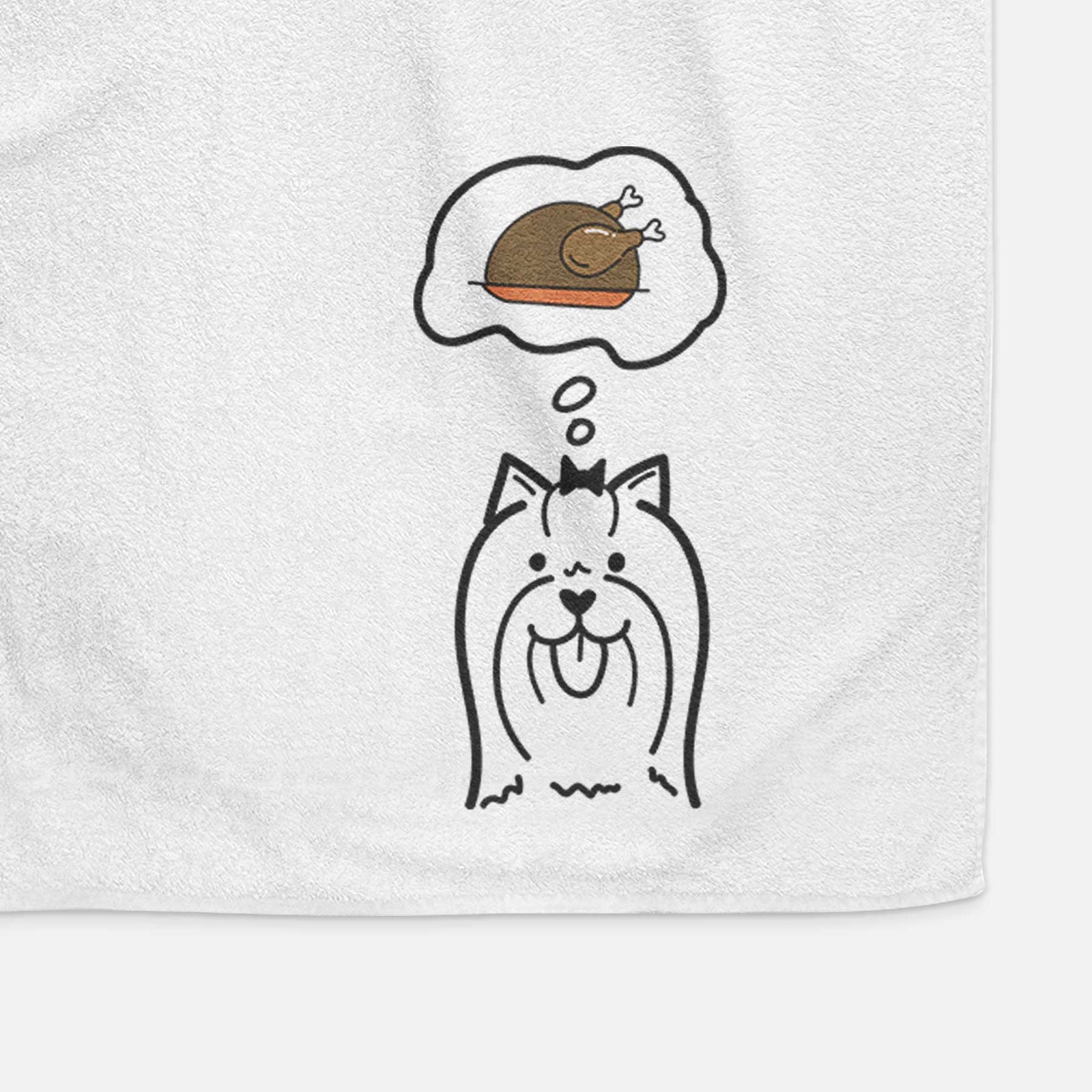 Minimalist line drawing of a Yorkshire Terrier with a little turkey on a decorative hand towel