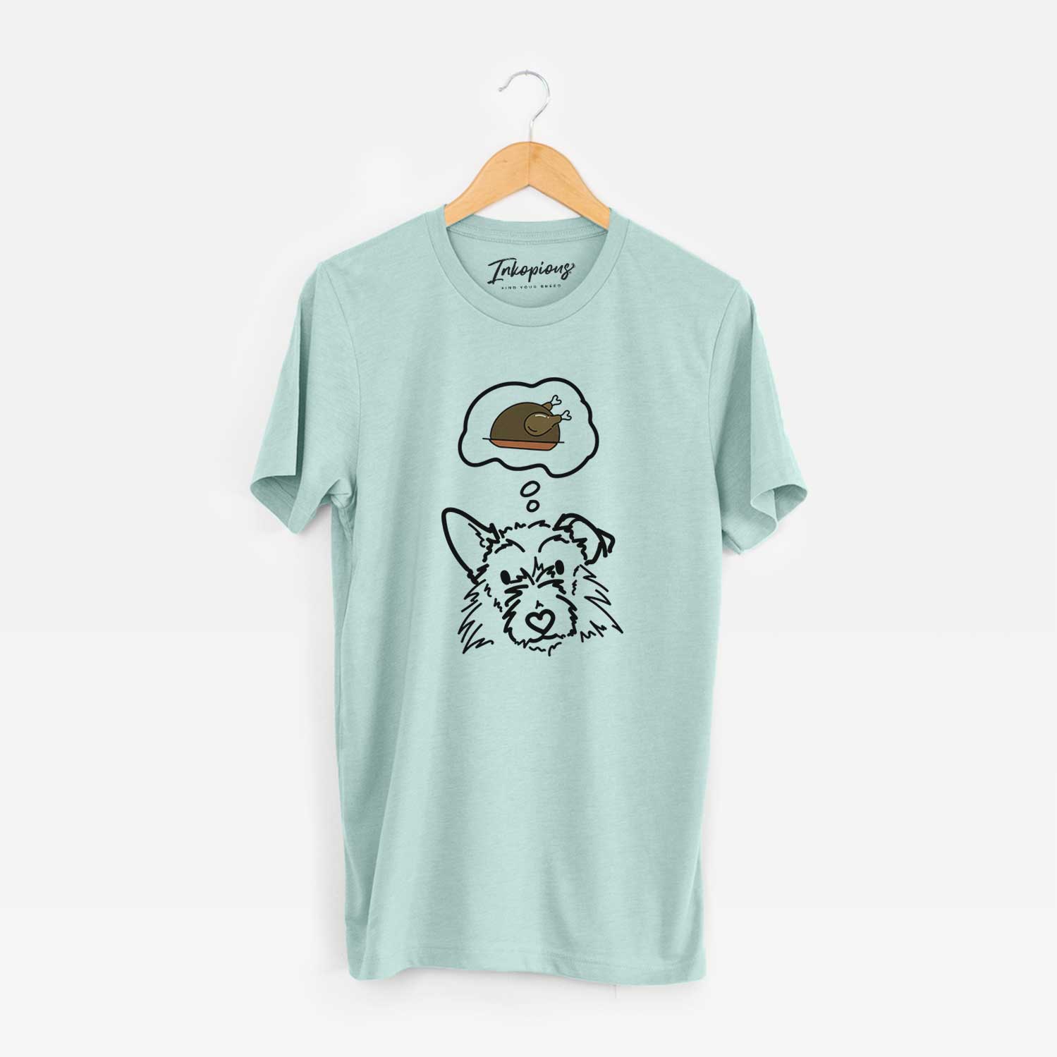 Minimalist line drawing of Ziggy the Terrier Mix with a little turkey on a Heather Sage Unisex crewneck