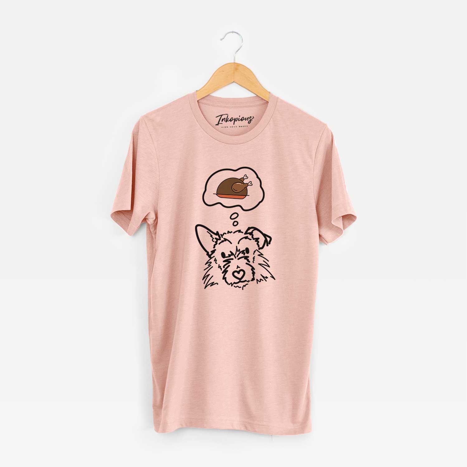 Minimalist line drawing of Ziggy the Terrier Mix with a little turkey on a Peach Unisex crewneck