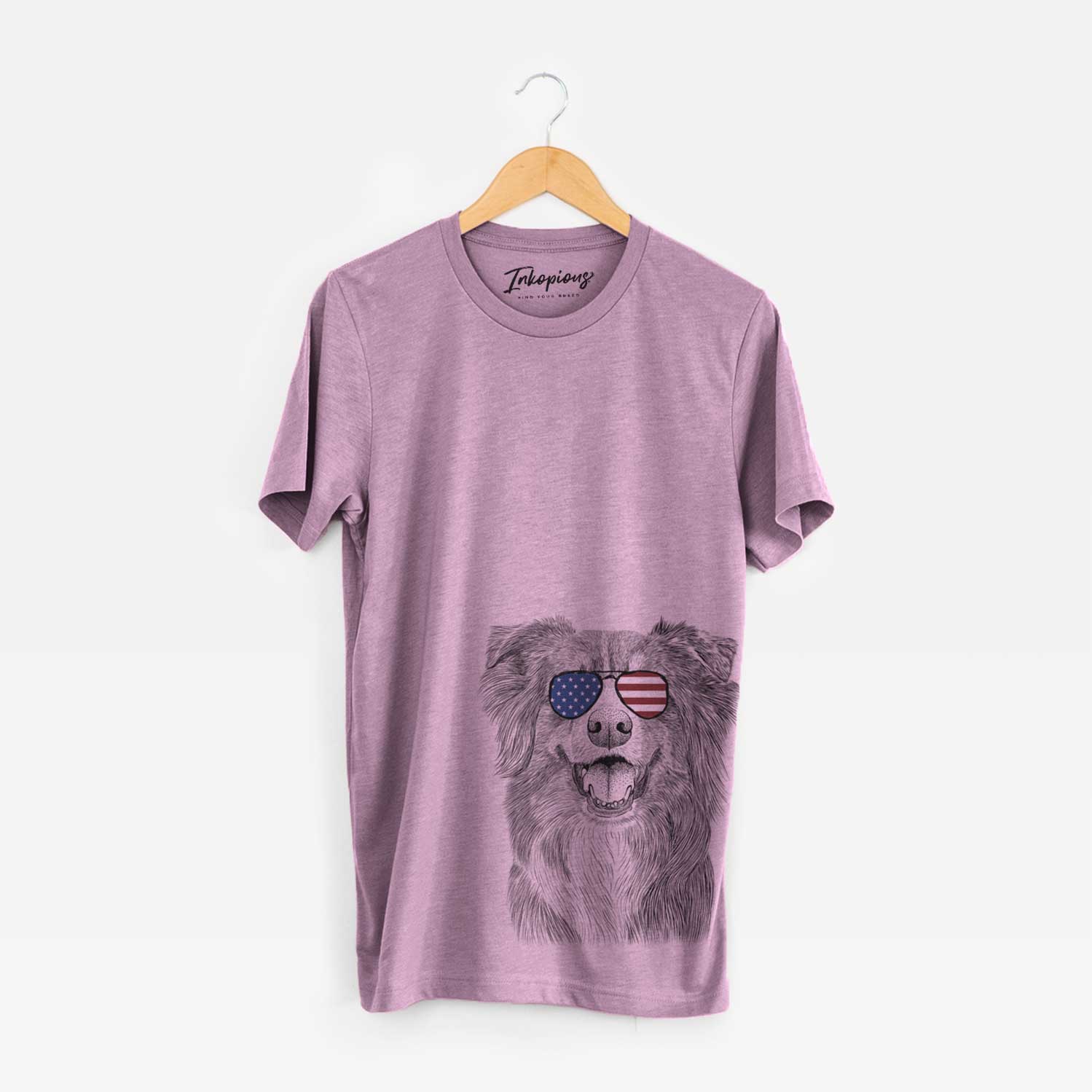 Hand-drawn sketch of Aussie Parker the Australian Shepherd wearing American flag sunglasses on an Orchid Unisex crewneck