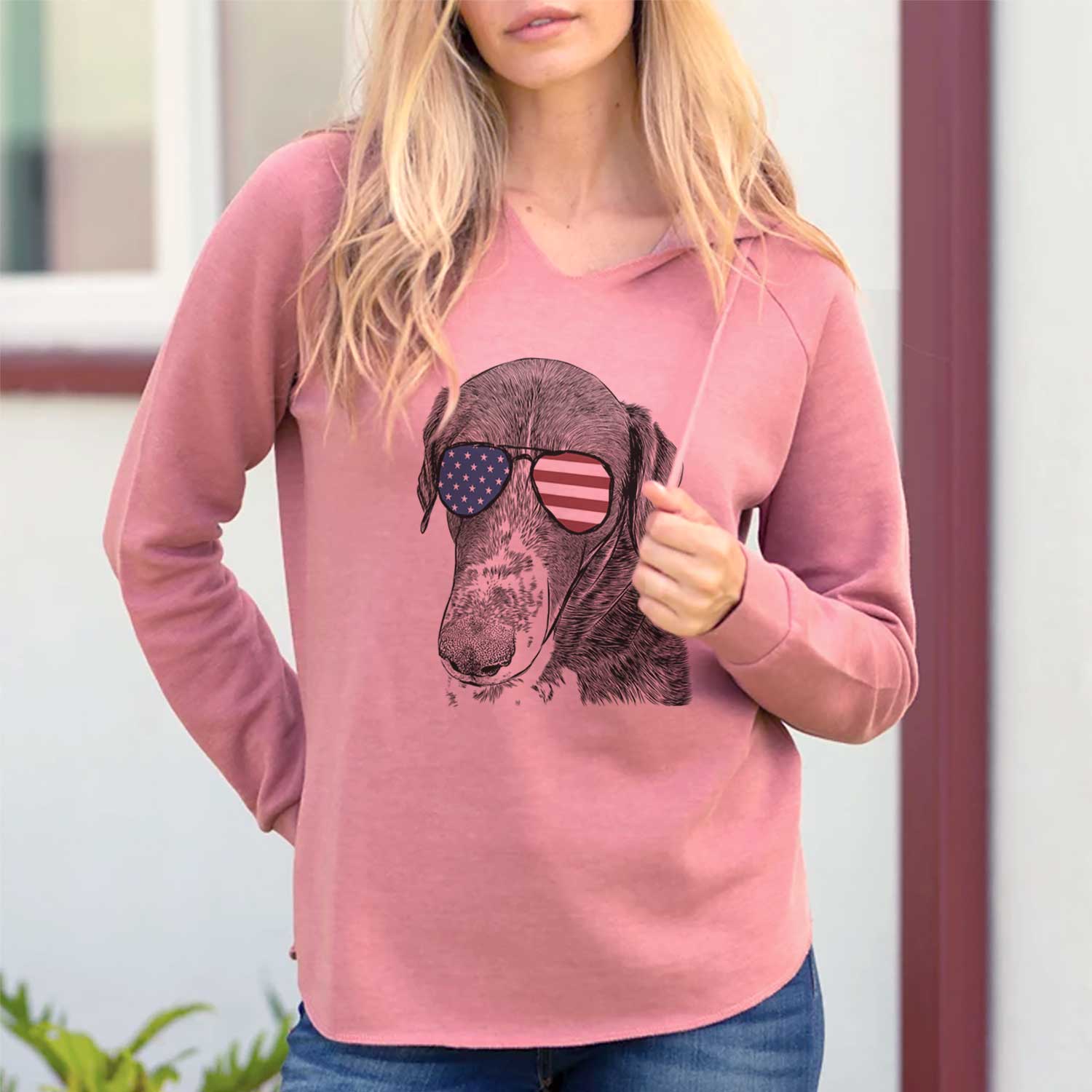 Hand-drawn sketch of Angel Orion the Mixed Breed wearing American flag sunglasses on a Dusty Rose Cali Wave Hooded Sweatshirt, lifestyle photo