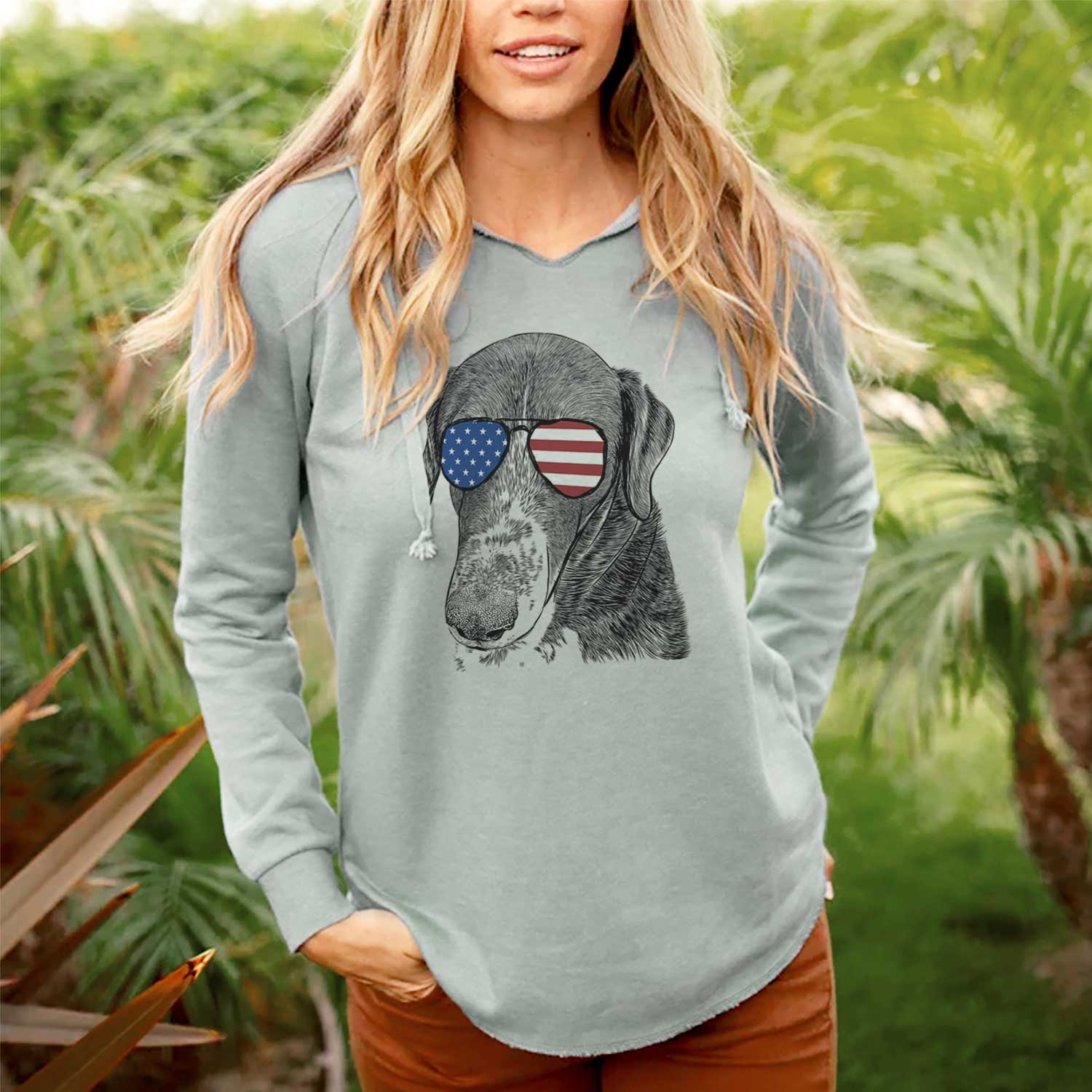 Hand-drawn sketch of Angel Orion the Mixed Breed wearing American flag sunglasses on a Sage Cali Wave Hooded Sweatshirt, lifestyle photo