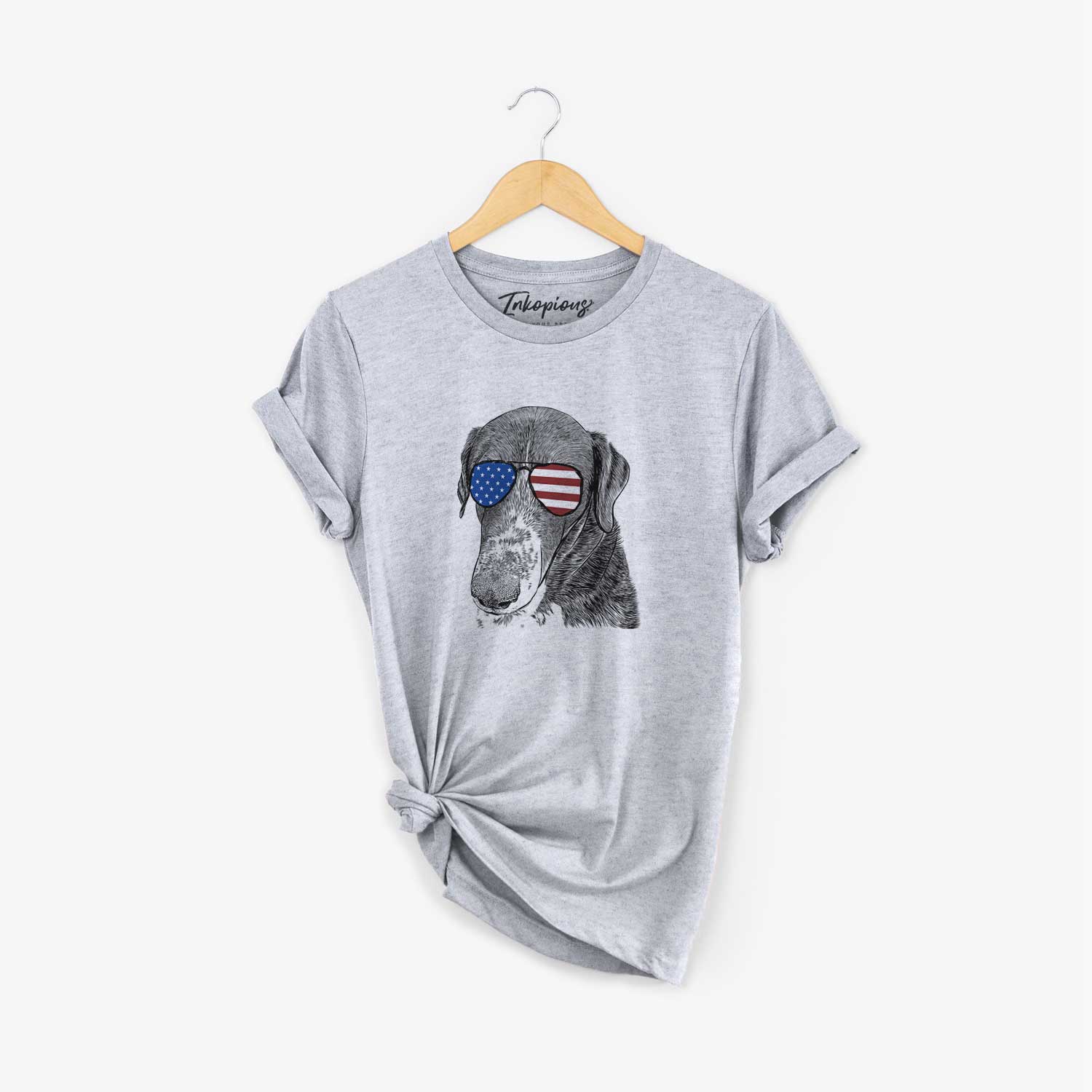 Hand-drawn sketch of Angel Orion the Mixed Breed wearing American flag sunglasses on a Grey Unisex crewneck