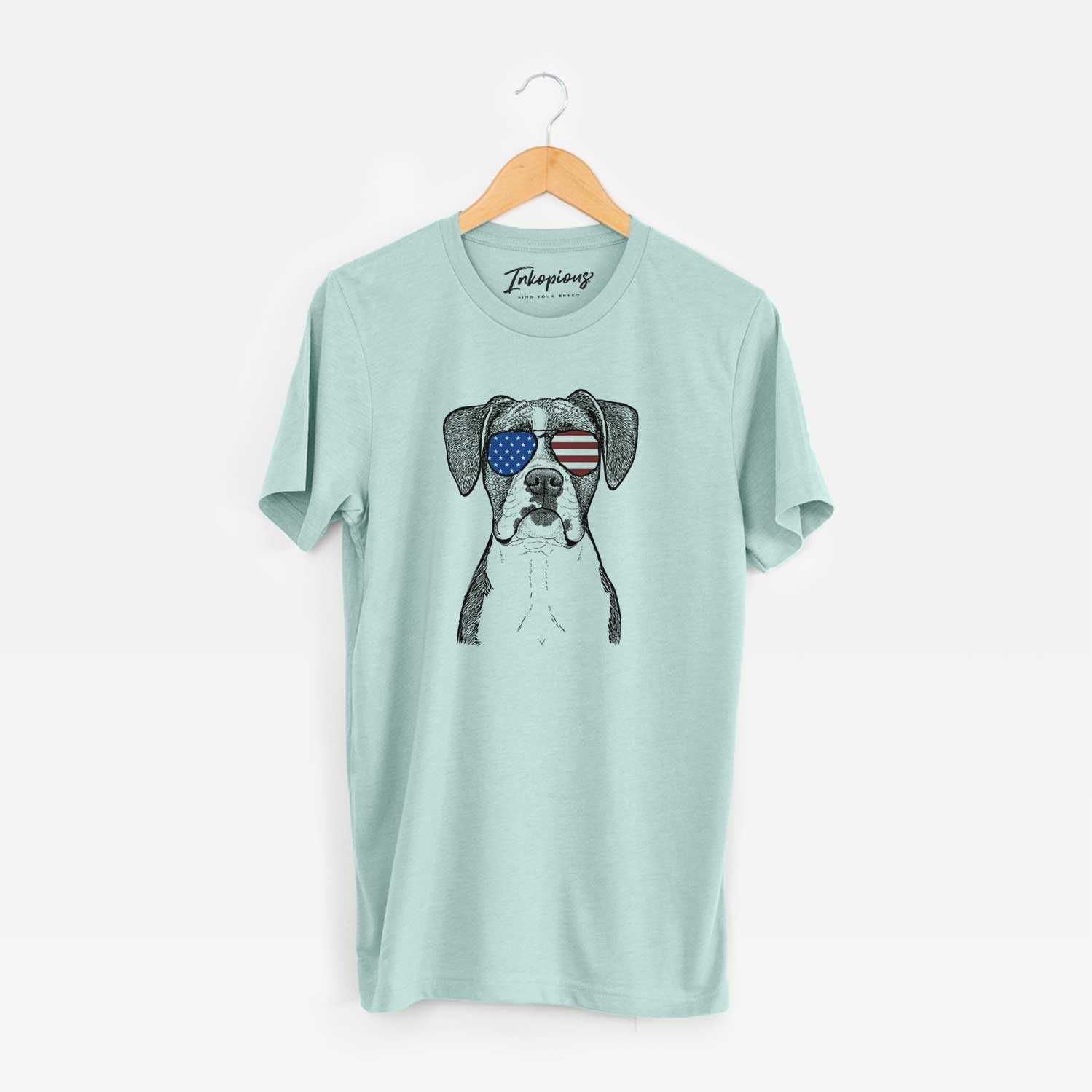 Hand-drawn sketch of Annie the Boxer wearing American flag sunglasses on a Heather Sage Unisex crewneck