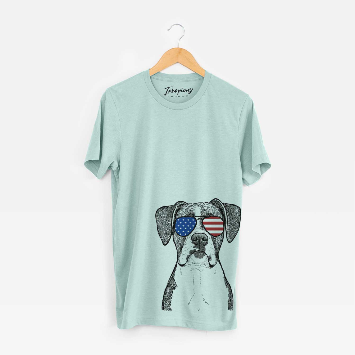 Hand-drawn sketch of Annie the Boxer wearing American flag sunglasses on a Heather Sage Unisex crewneck