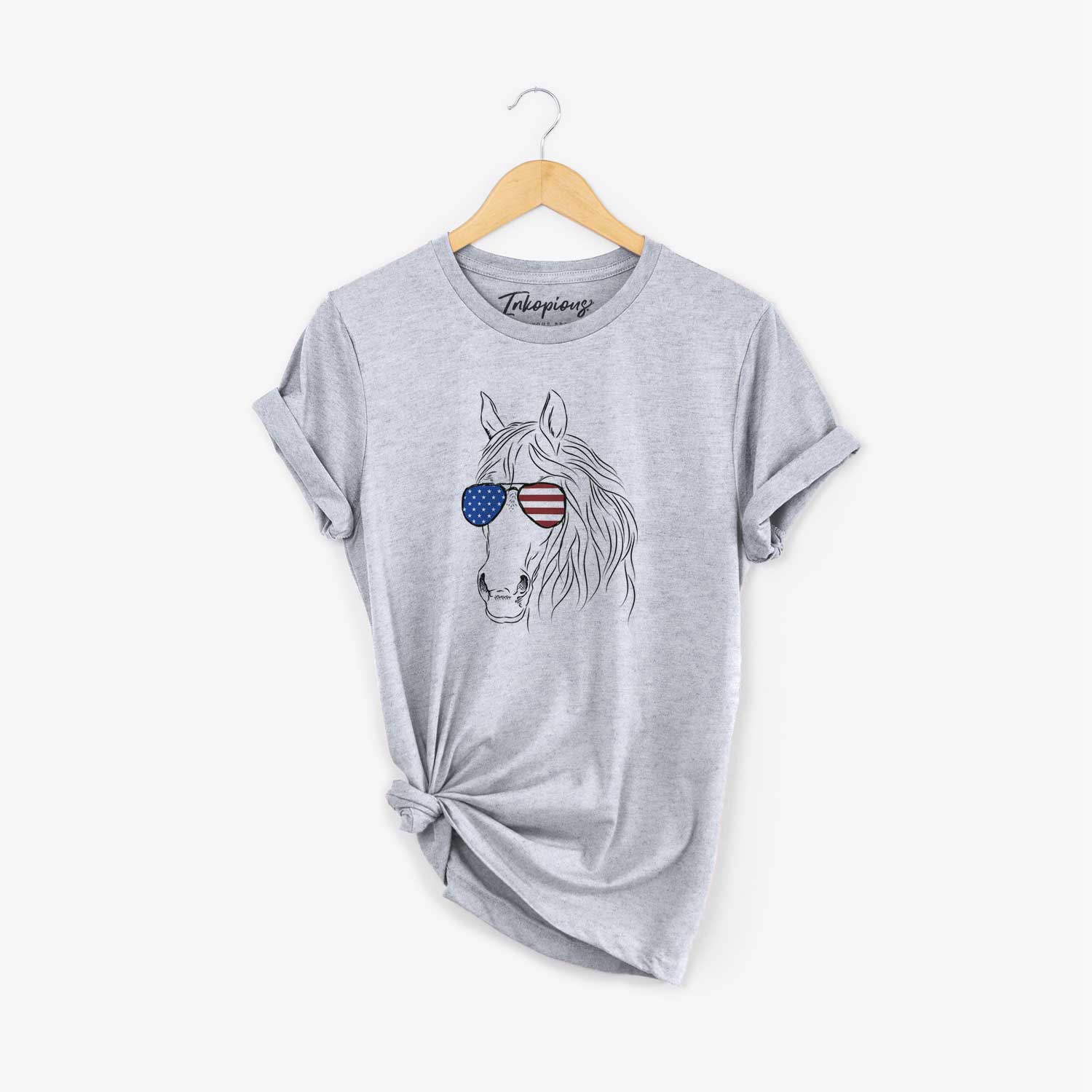 Hand-drawn sketch of Aria the Horse wearing American flag sunglasses on a Grey Unisex crewneck