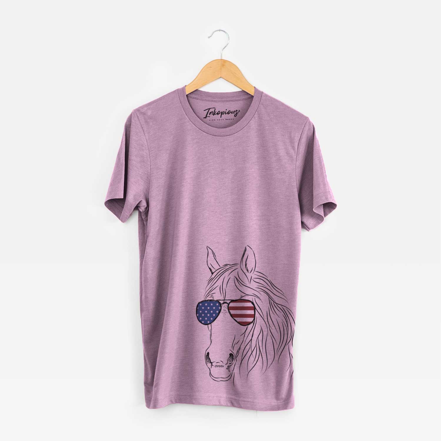 Hand-drawn sketch of Aria the Horse wearing American flag sunglasses on an Orchid Unisex crewneck