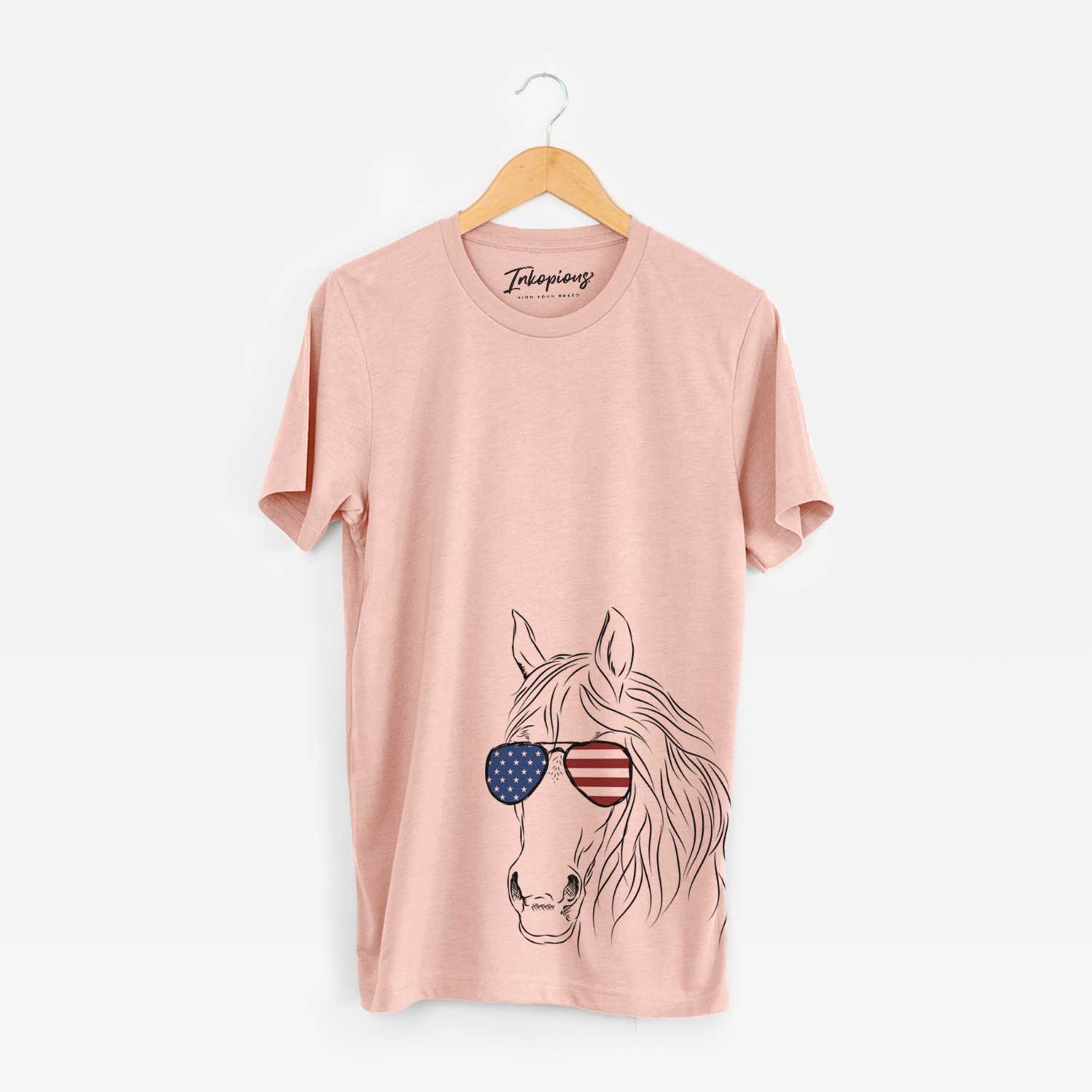 Hand-drawn sketch of Aria the Horse wearing American flag sunglasses on a Peach Unisex crewneck