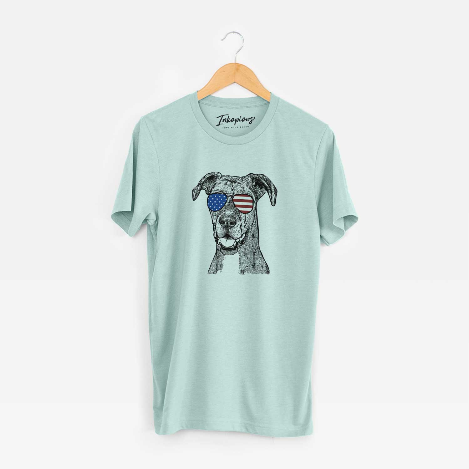 Hand-drawn sketch of Athena the Merle Great Dane wearing American flag sunglasses on a Heather Sage Unisex crewneck