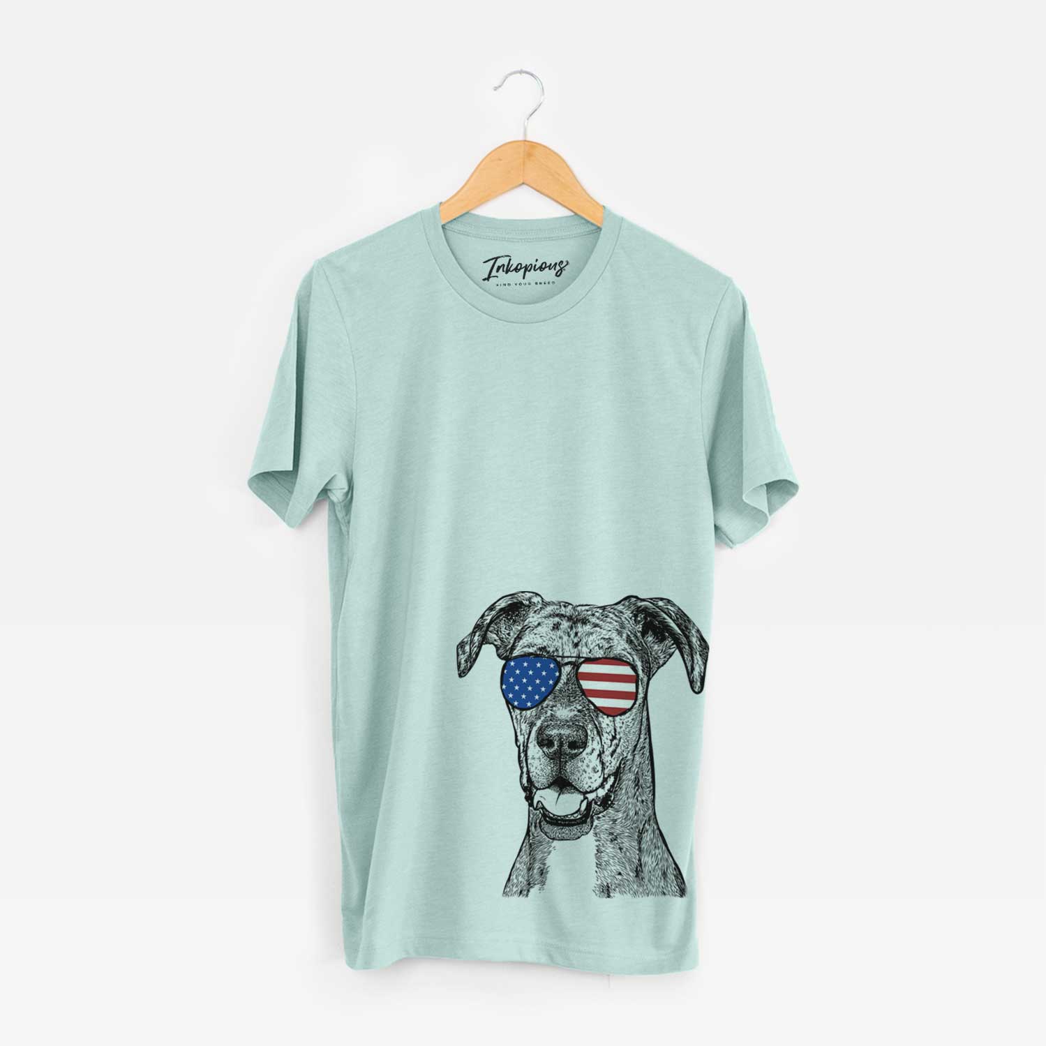 Hand-drawn sketch of Athena the Merle Great Dane wearing American flag sunglasses on a Heather Sage Unisex crewneck
