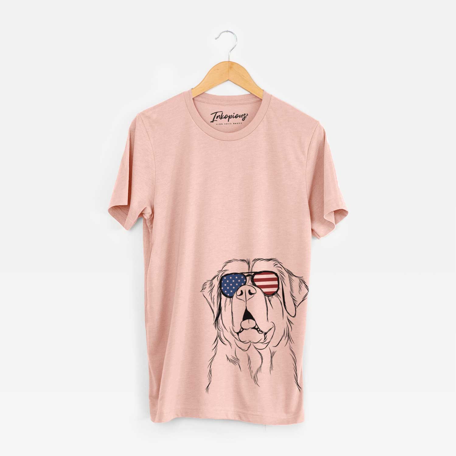 Hand-drawn sketch of Atlas the Saint Bernard wearing American flag sunglasses on a Peach Unisex crewneck