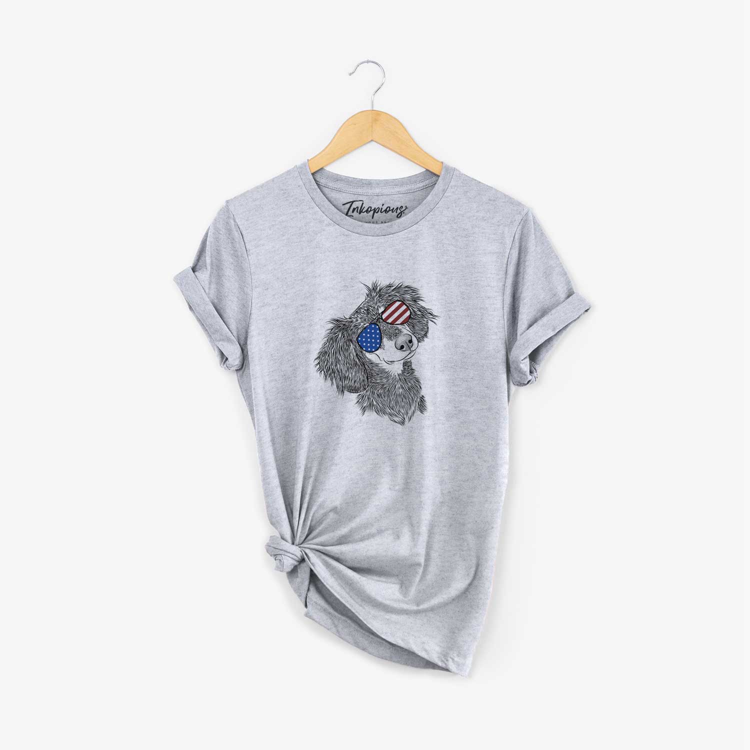 Hand-drawn sketch of Bailey the Long Haired Dachshund wearing American flag sunglasses on a Grey Unisex crewneck