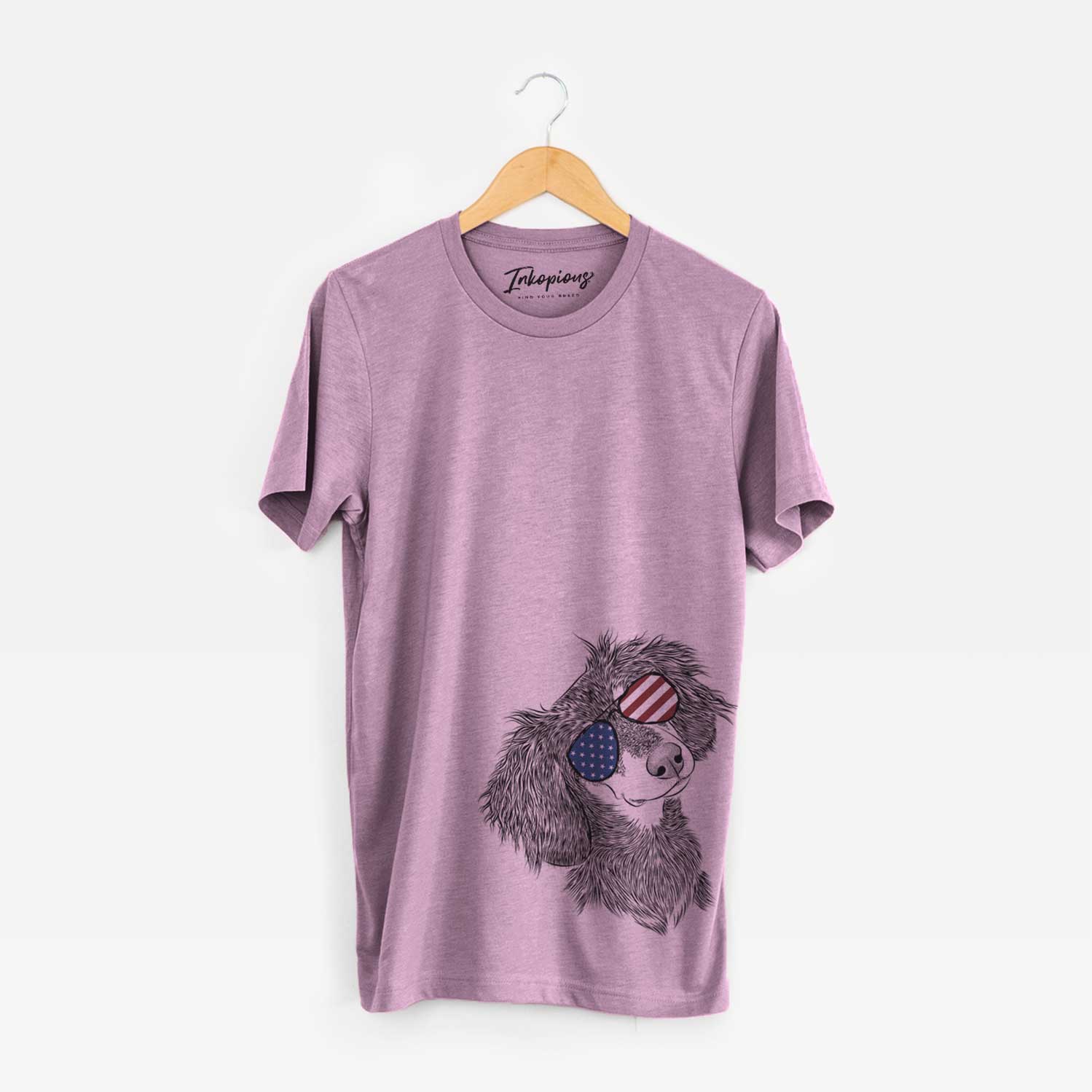 Hand-drawn sketch of Bailey the Long Haired Dachshund wearing American flag sunglasses on an Orchid Unisex crewneck