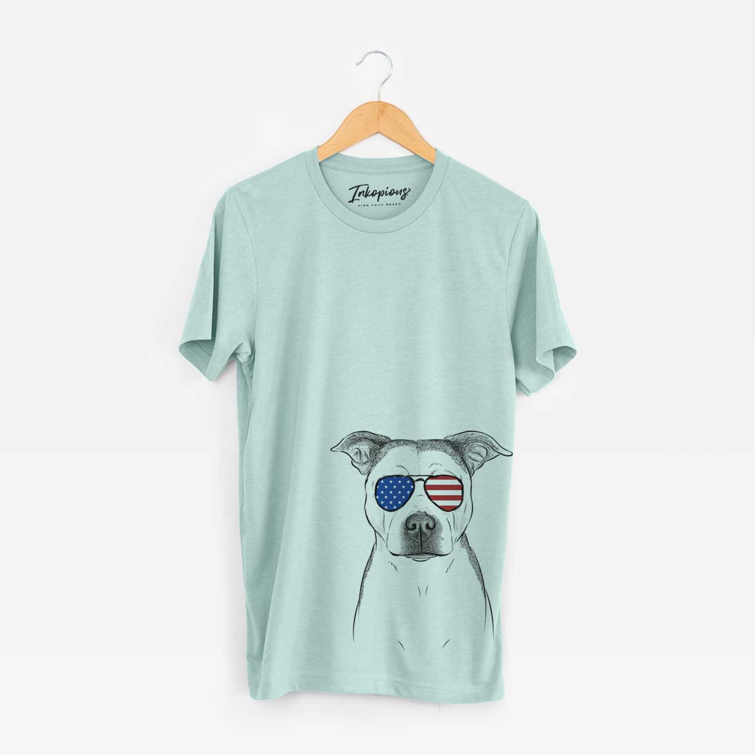 Hand-drawn sketch of Bailey the Pitbull wearing American flag sunglasses on a Heather Sage Unisex crewneck