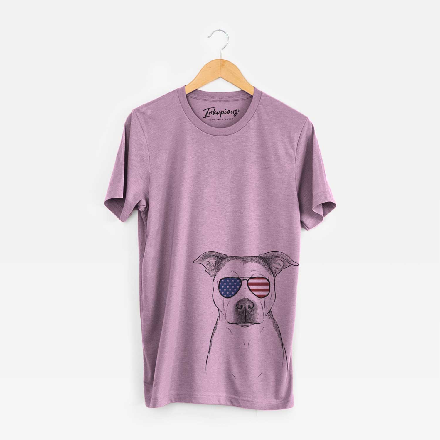 Hand-drawn sketch of Bailey the Pitbull wearing American flag sunglasses on an Orchid Unisex crewneck