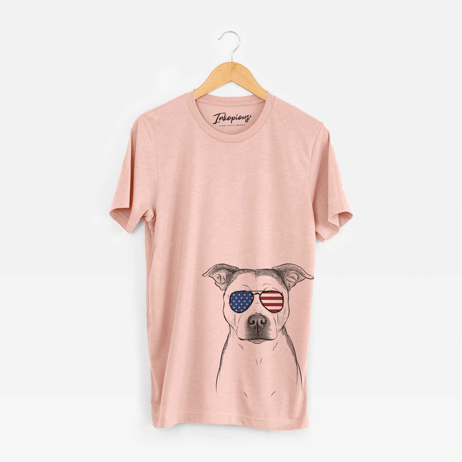 Hand-drawn sketch of Bailey the Pitbull wearing American flag sunglasses on a Peach Unisex crewneck