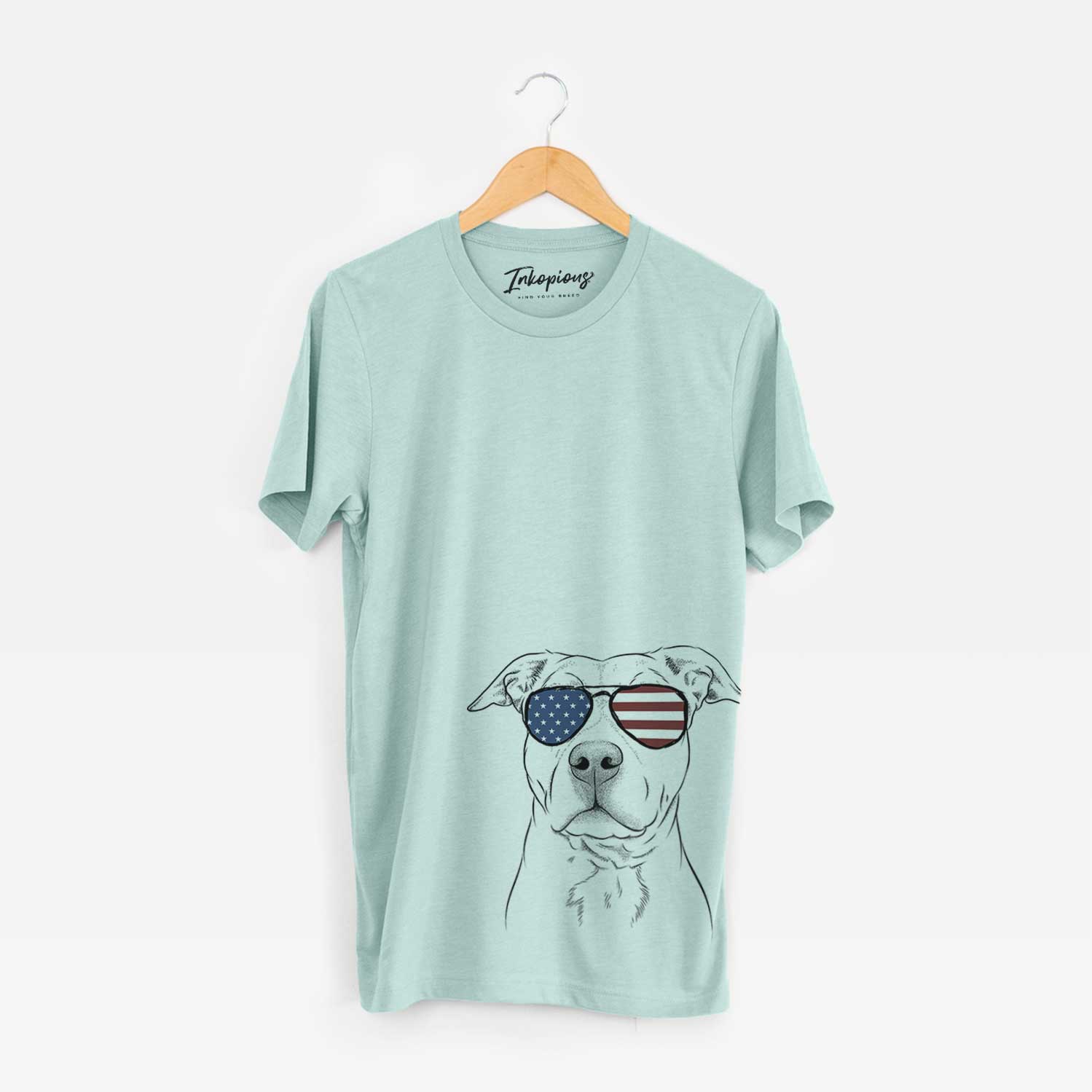 Hand-drawn sketch of Bailey the American Staffordshire Terrier wearing American flag sunglasses on a Heather Sage Unisex crewneck