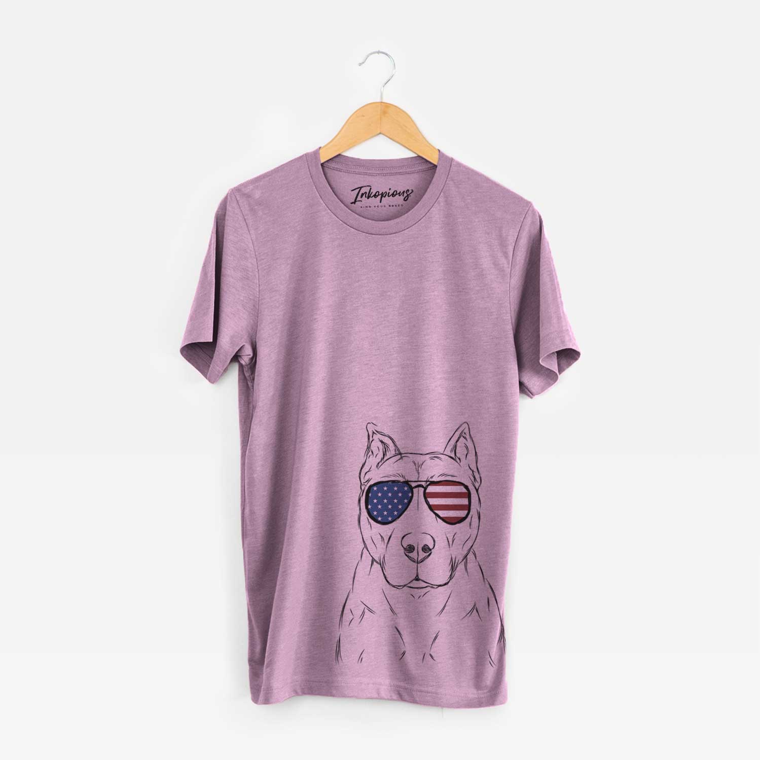 Hand-drawn sketch of Bane the Pitbull Mix wearing American flag sunglasses on an Orchid Unisex crewneck
