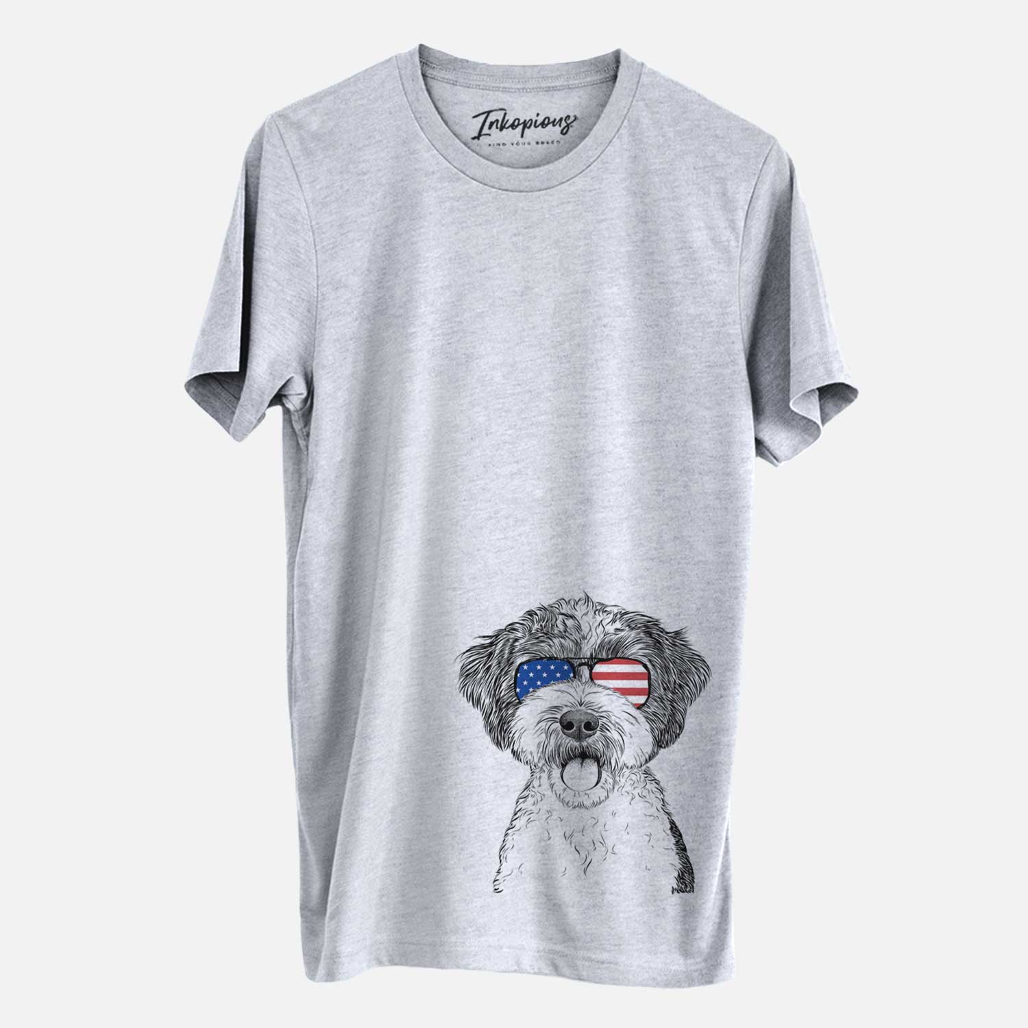 Hand-drawn sketch of Bella the Cockapoo wearing American flag sunglasses on a Grey Unisex crewneck