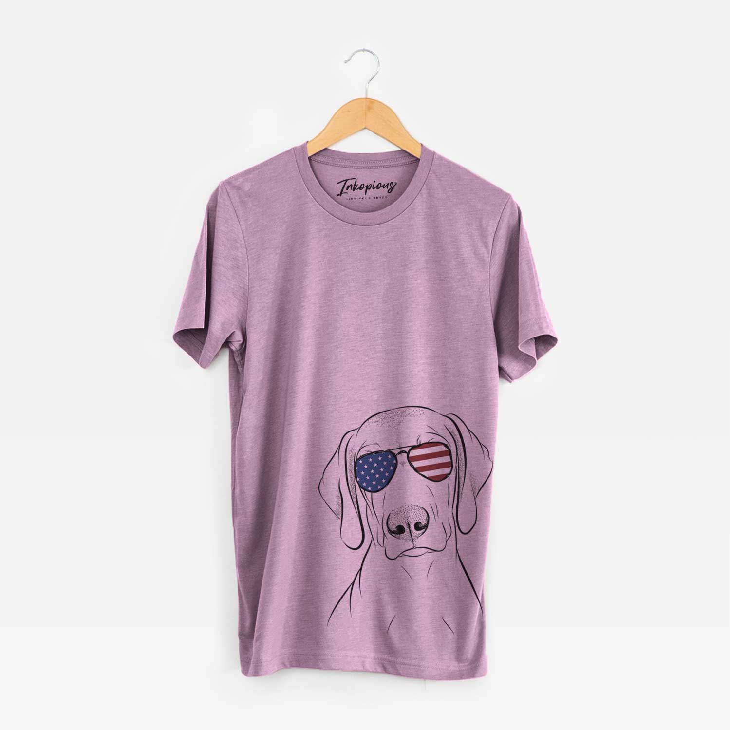 Hand-drawn sketch of Benelli the Vizsla wearing American flag sunglasses on an Orchid Unisex crewneck