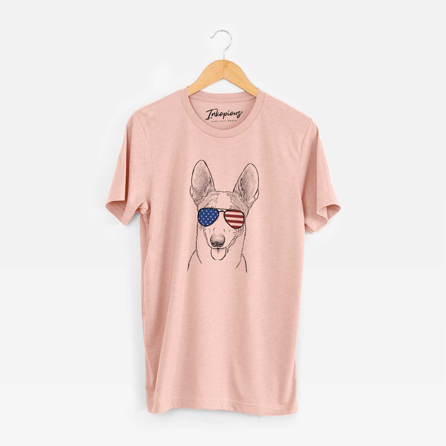 Hand-drawn sketch of Berlin the Carolina Dog wearing American flag sunglasses on a Peach Unisex crewneck