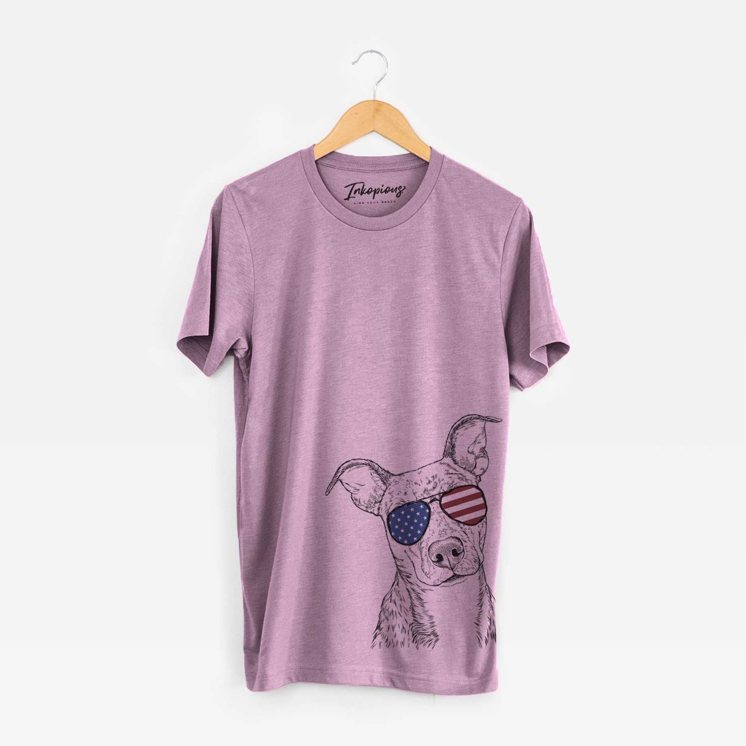 Hand-drawn sketch of Bianca the Mixed Breed wearing American flag sunglasses on an Orchid Unisex crewneck