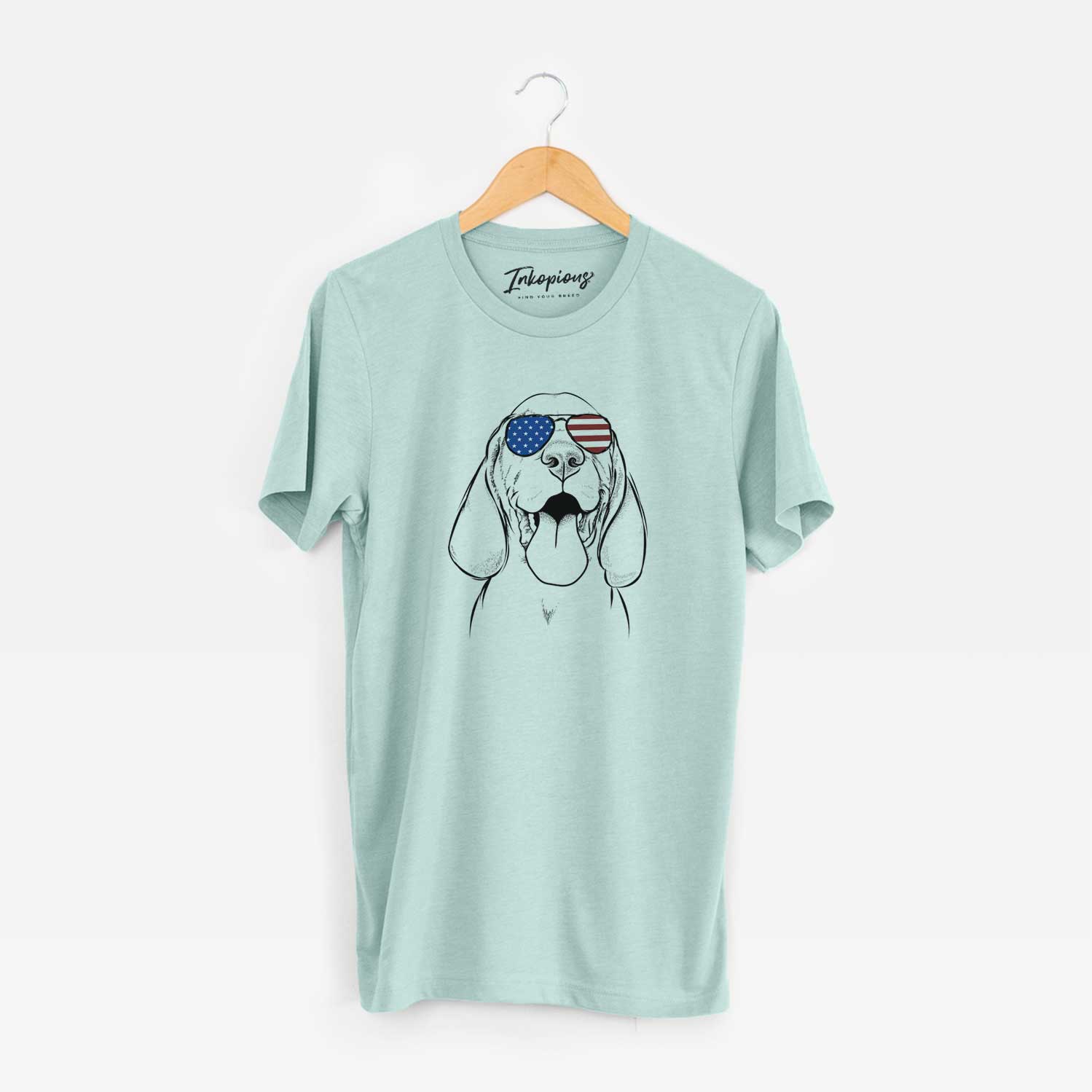 Hand-drawn sketch of Bodi the Vizsla wearing American flag sunglasses on a Heather Sage Unisex crewneck