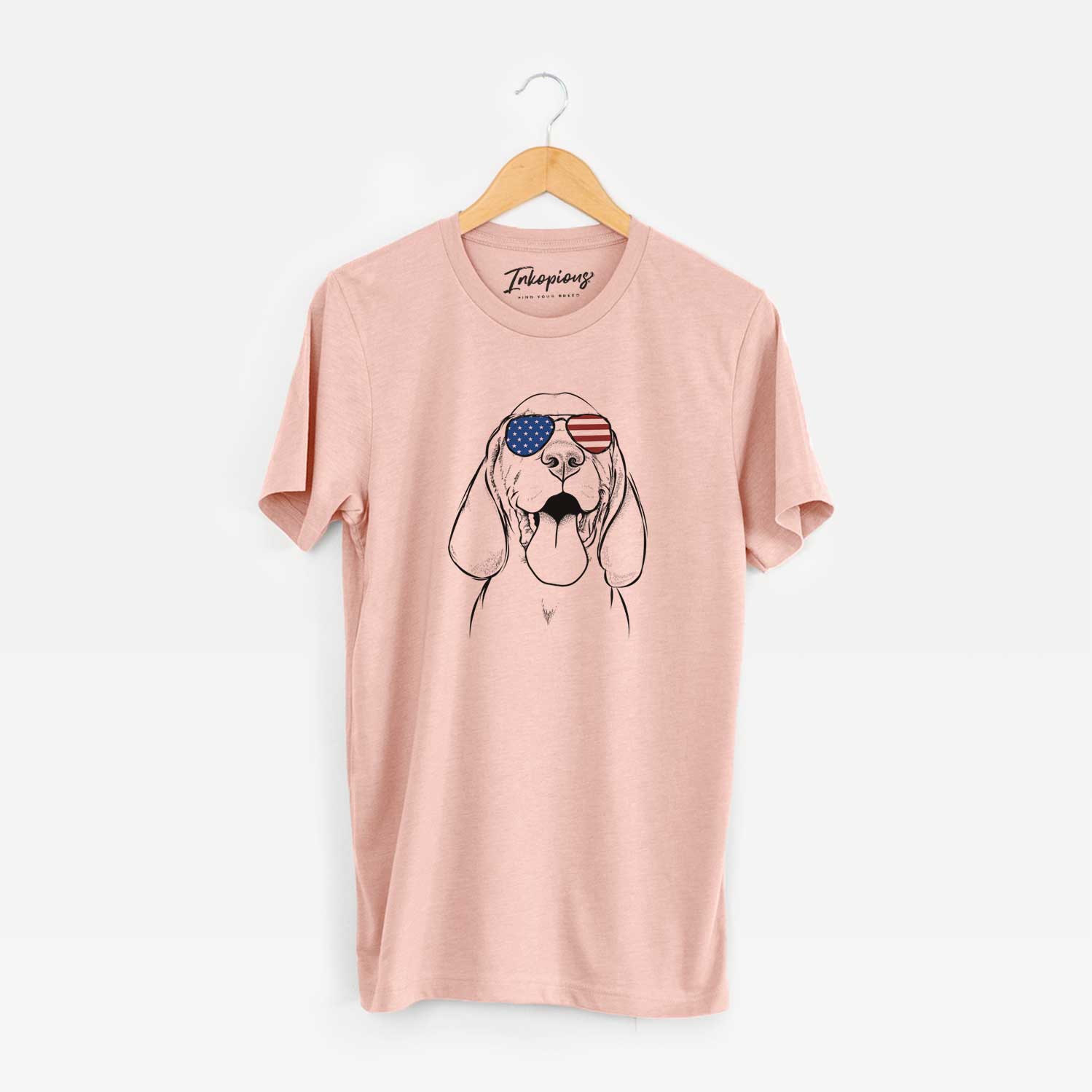Hand-drawn sketch of Bodi the Vizsla wearing American flag sunglasses on a Peach Unisex crewneck