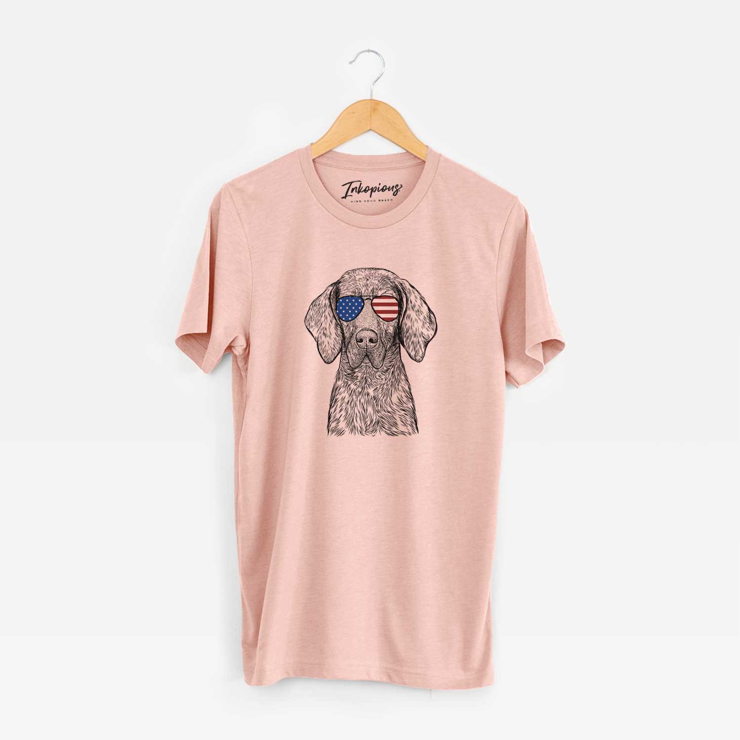 Hand-drawn sketch of Boone the Plott Hound wearing American flag sunglasses on a Peach Unisex crewneck