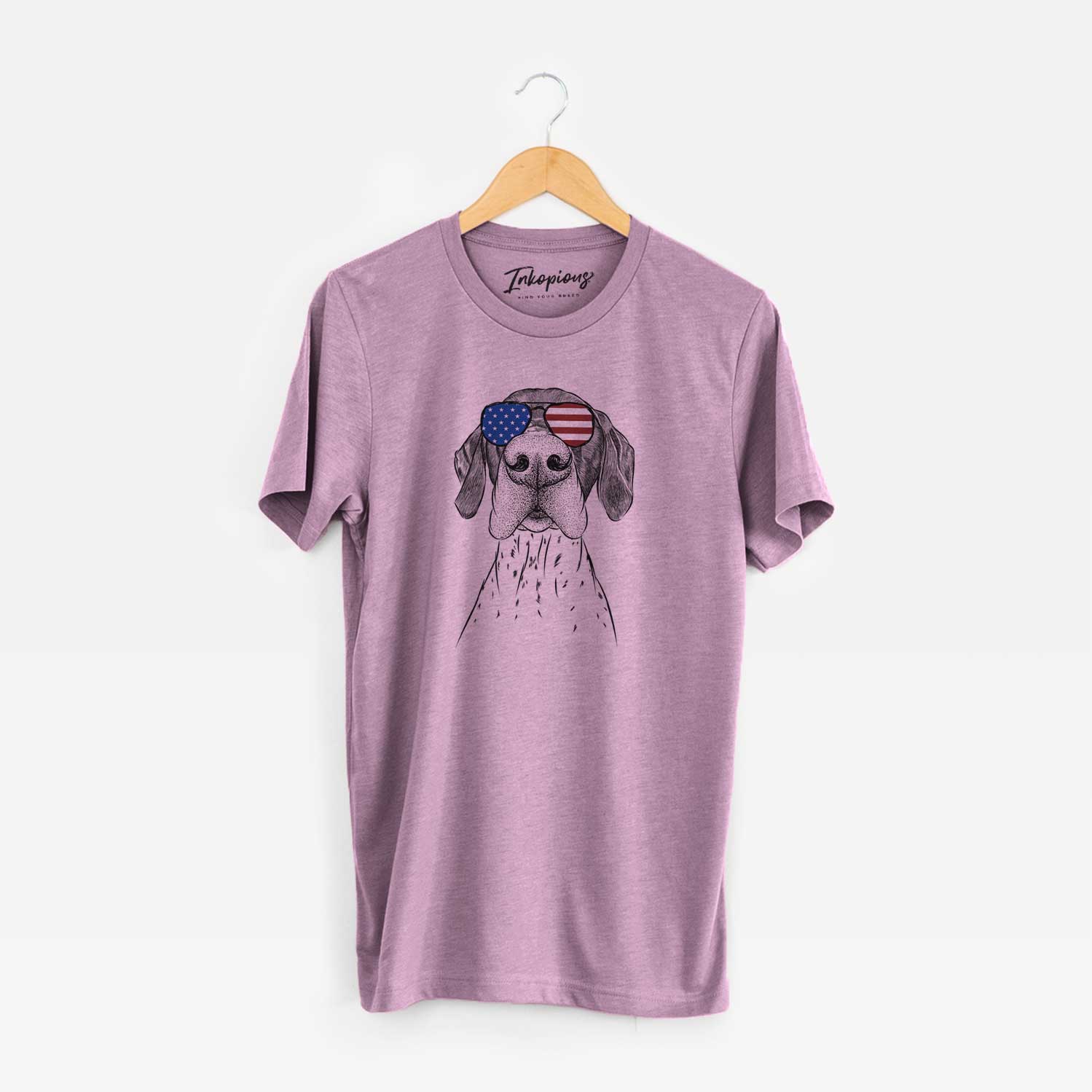 Hand-drawn sketch of Booze the German Shorthaired Pointer wearing American flag sunglasses on an Orchid Unisex crewneck