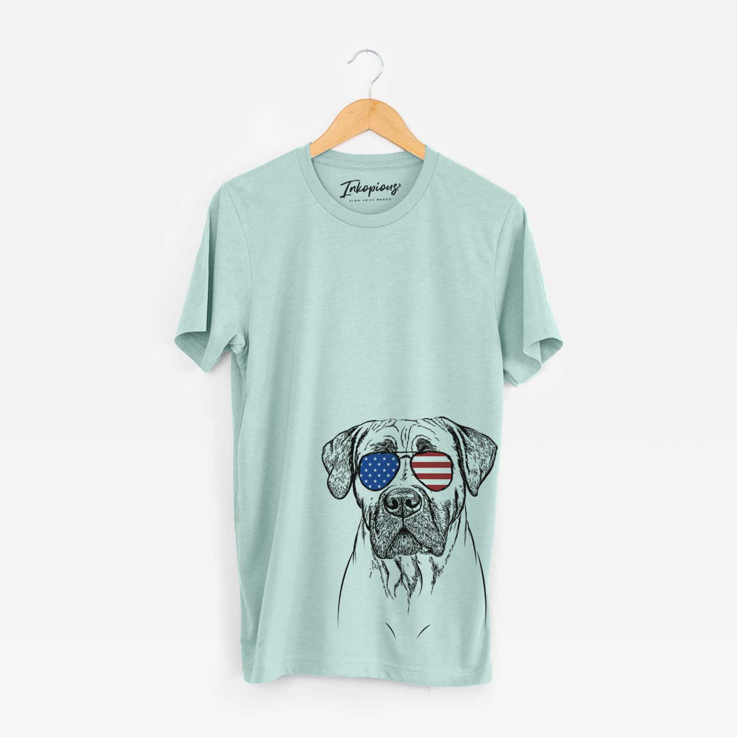 Hand-drawn sketch of Boris the Boerboel wearing American flag sunglasses on a Heather Sage Unisex crewneck