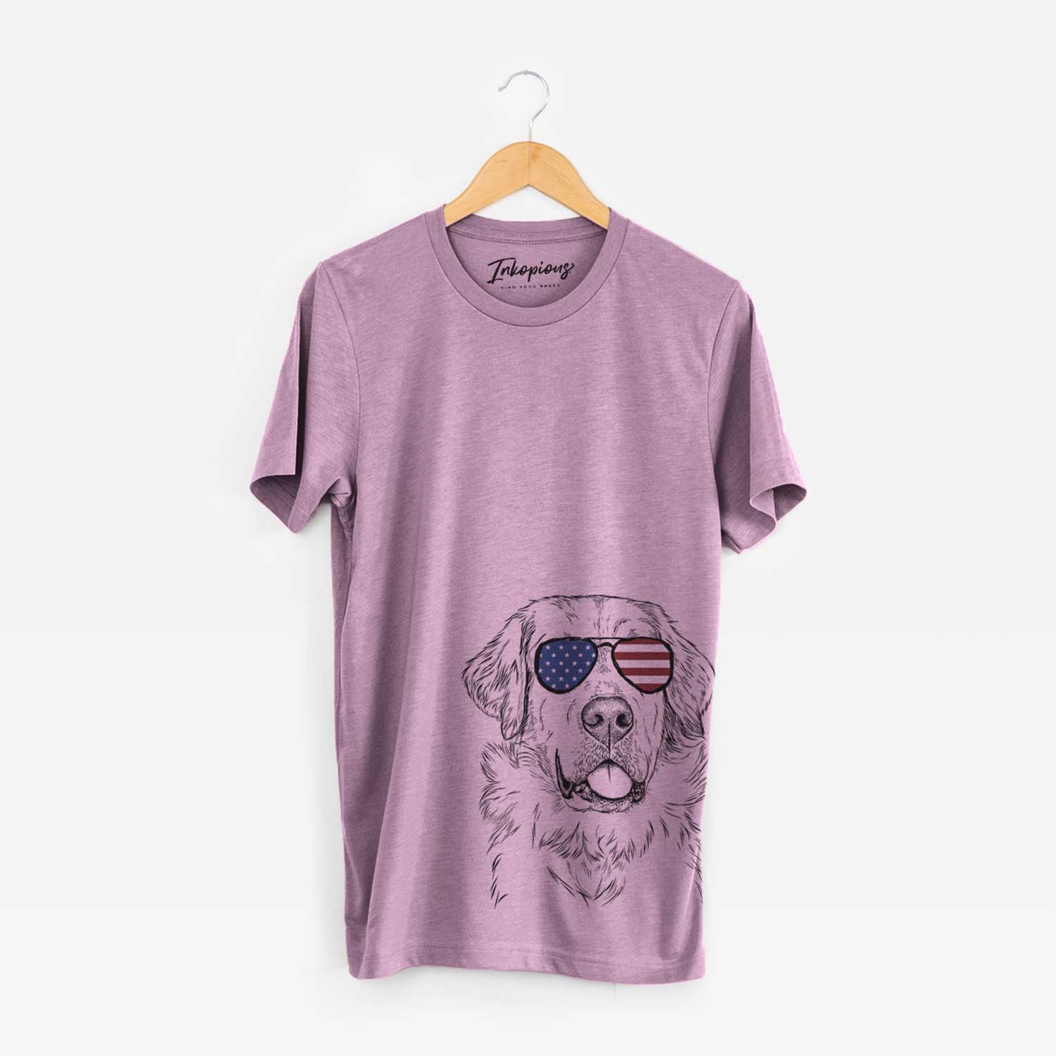 Hand-drawn sketch of Brophy the Great Pyrenees wearing American flag sunglasses on an Orchid Unisex crewneck