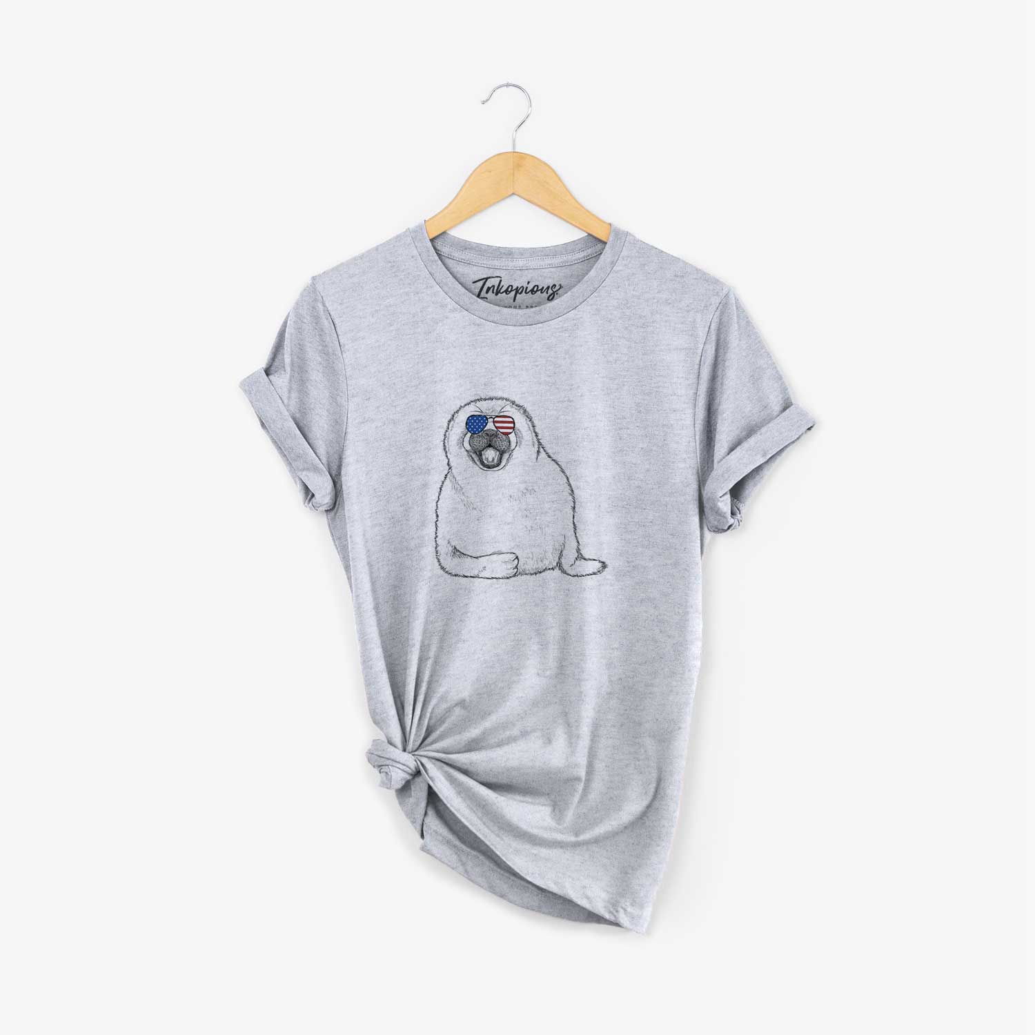 Hand-drawn sketch of Bub the Harp Seal wearing American flag sunglasses on a Grey Unisex crewneck