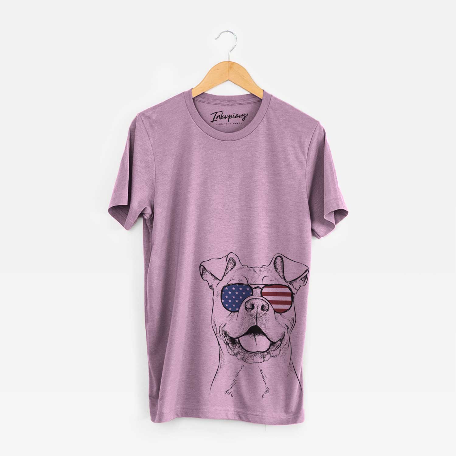 Hand-drawn sketch of Bubba Scraps the American Staffordshire Mix wearing American flag sunglasses on an Orchid Unisex crewneck