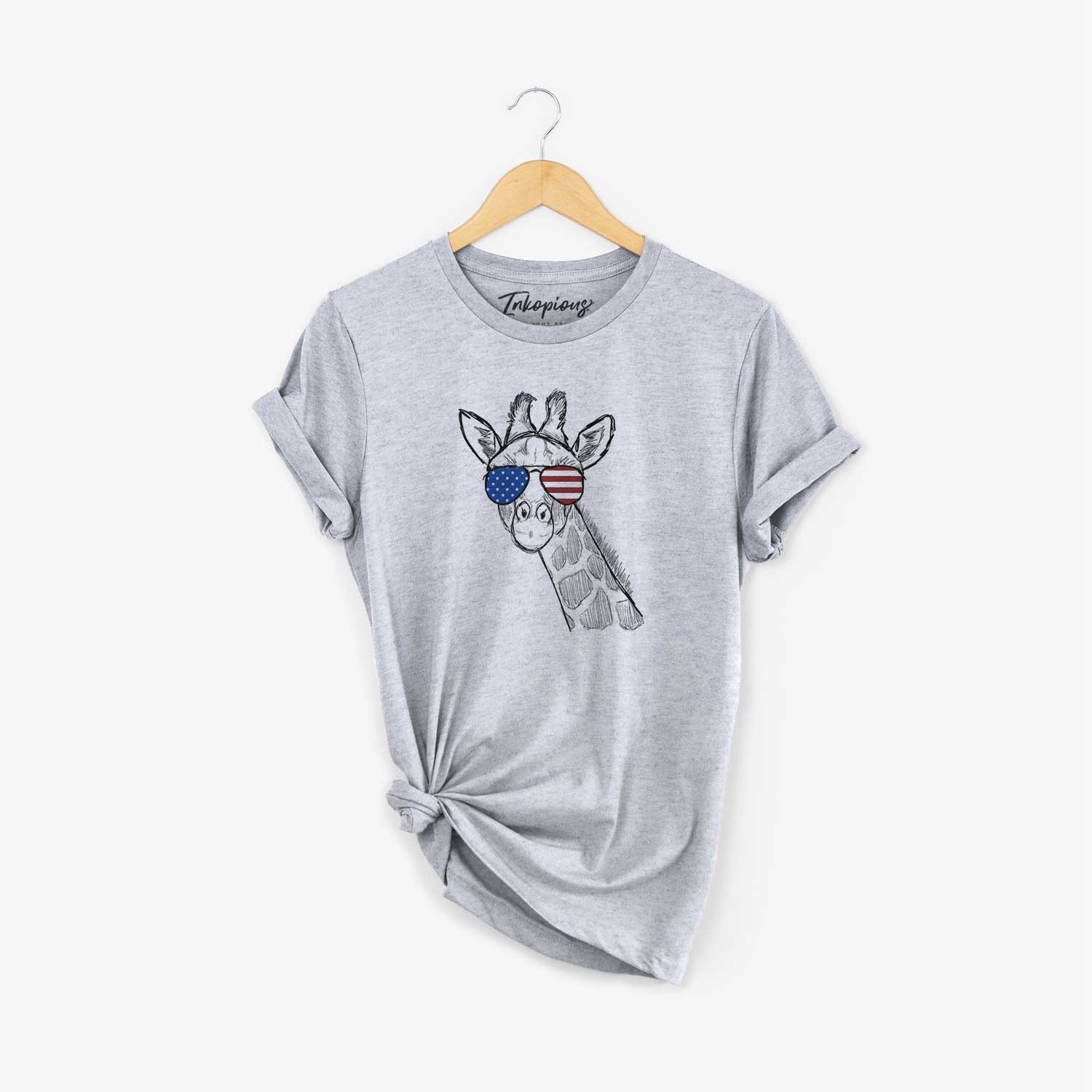 Hand-drawn sketch of Cedrick the Giraffe wearing American flag sunglasses on a Grey Unisex crewneck