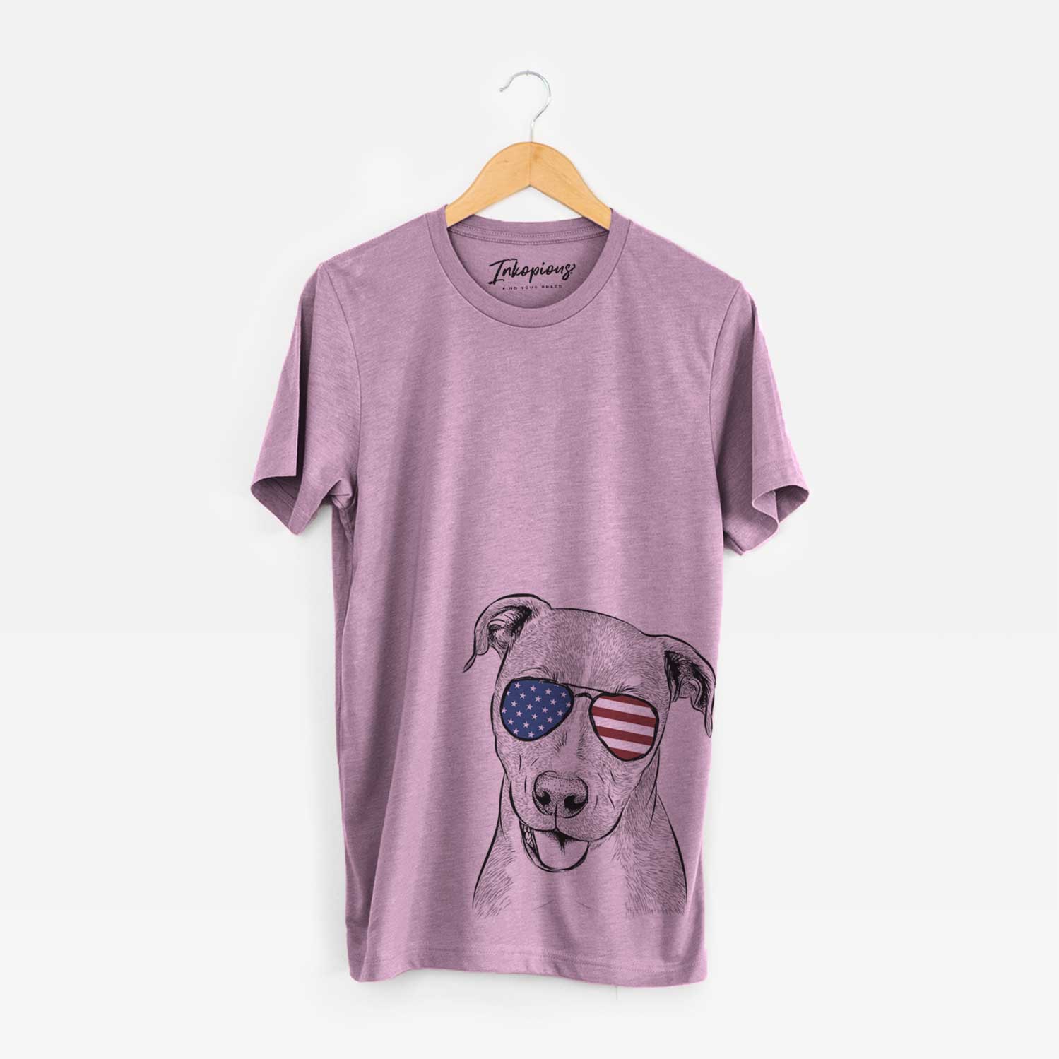 Hand-drawn sketch of Claiborne the American Staffordshire Terrier wearing American flag sunglasses on an Orchid Unisex crewneck