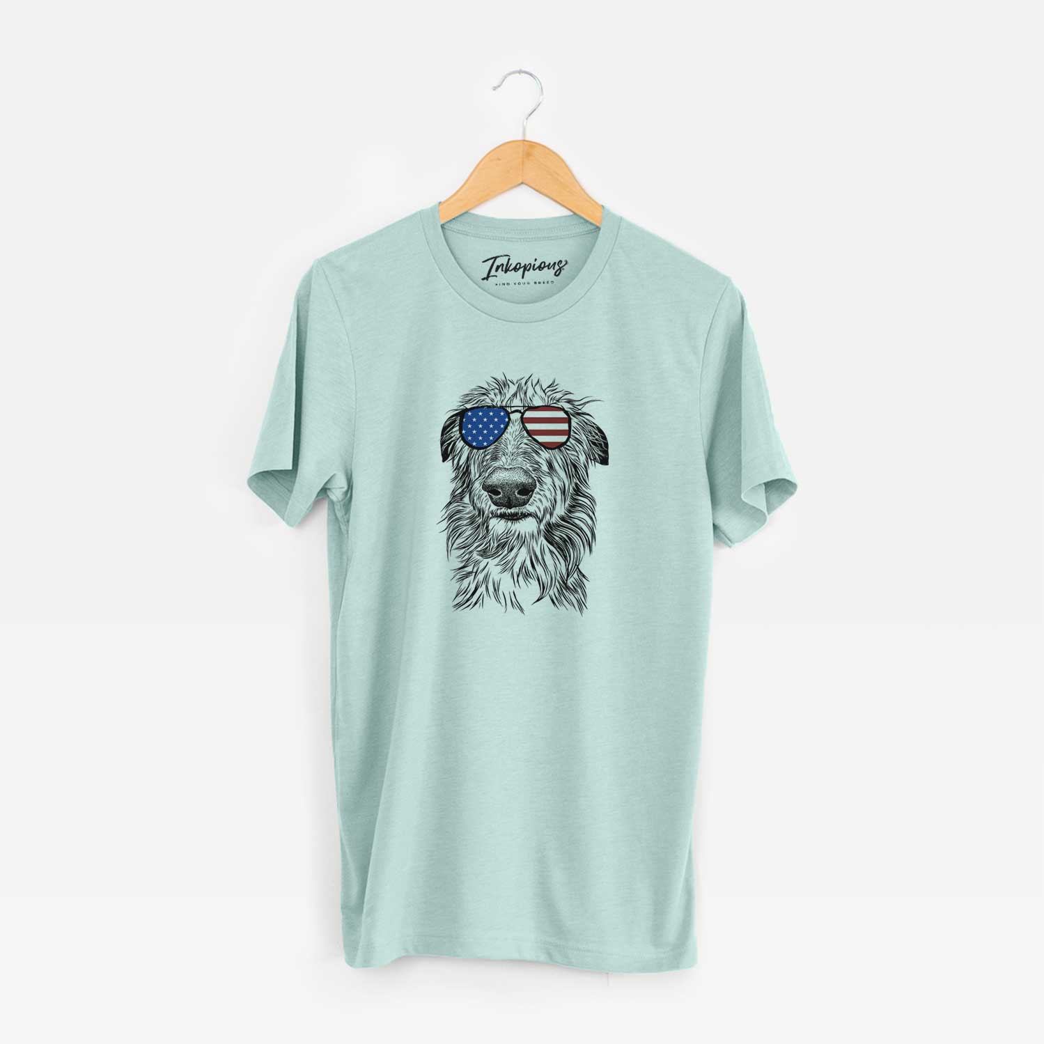 Hand-drawn sketch of Cleod the Scottish Deerhound wearing American flag sunglasses on a Heather Sage Unisex crewneck