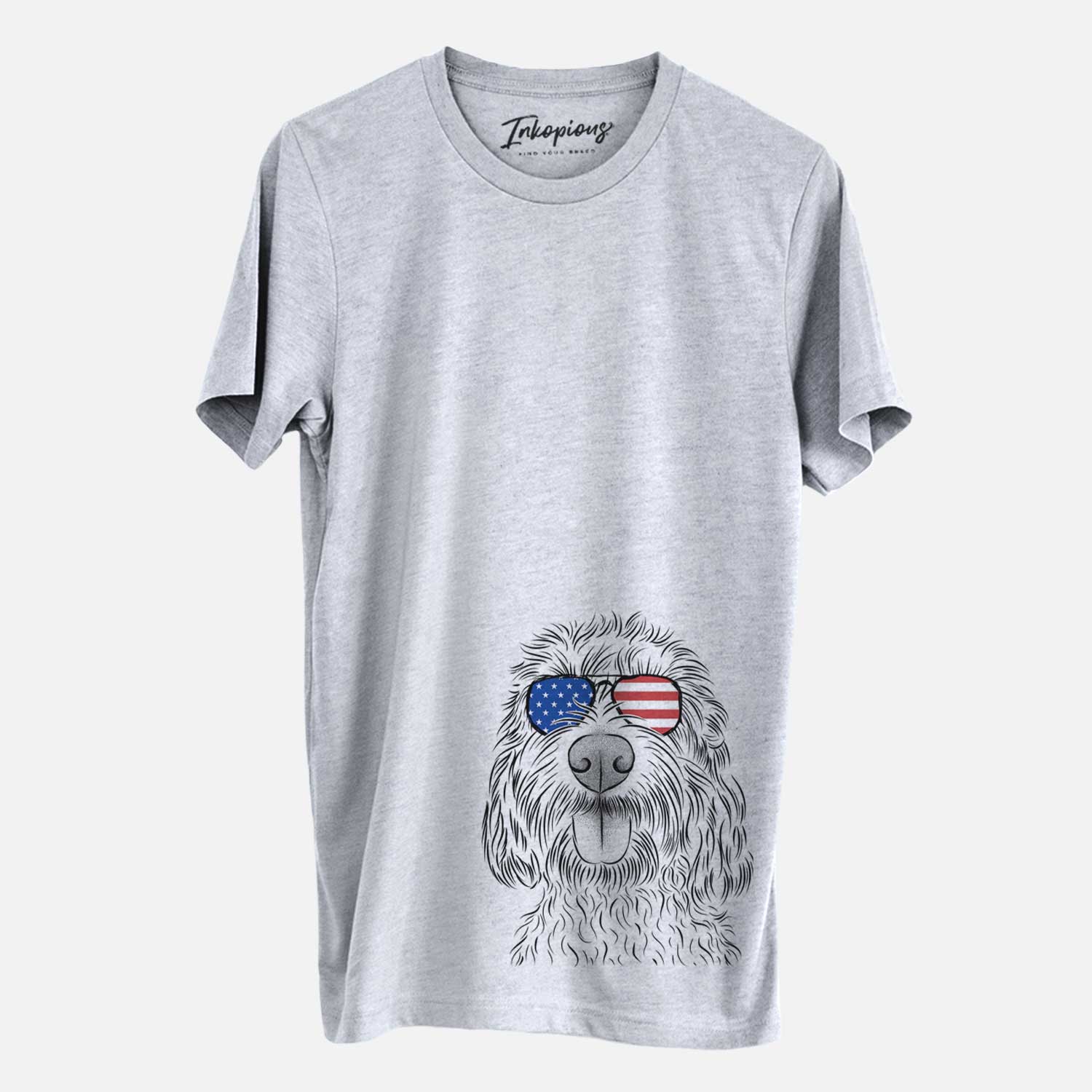 Hand-drawn sketch of Clover the Cockapoo wearing American flag sunglasses on a Grey Unisex crewneck