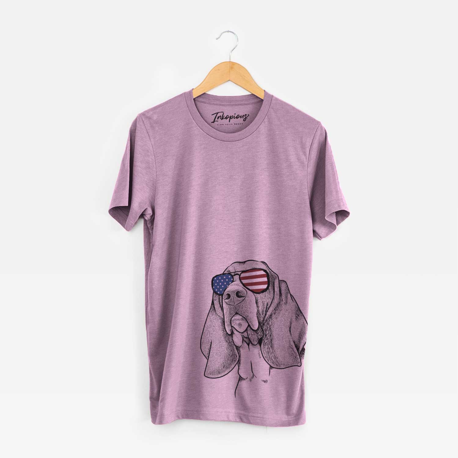 Hand-drawn sketch of Cooper the Basset Hound wearing American flag sunglasses on an Orchid Unisex crewneck