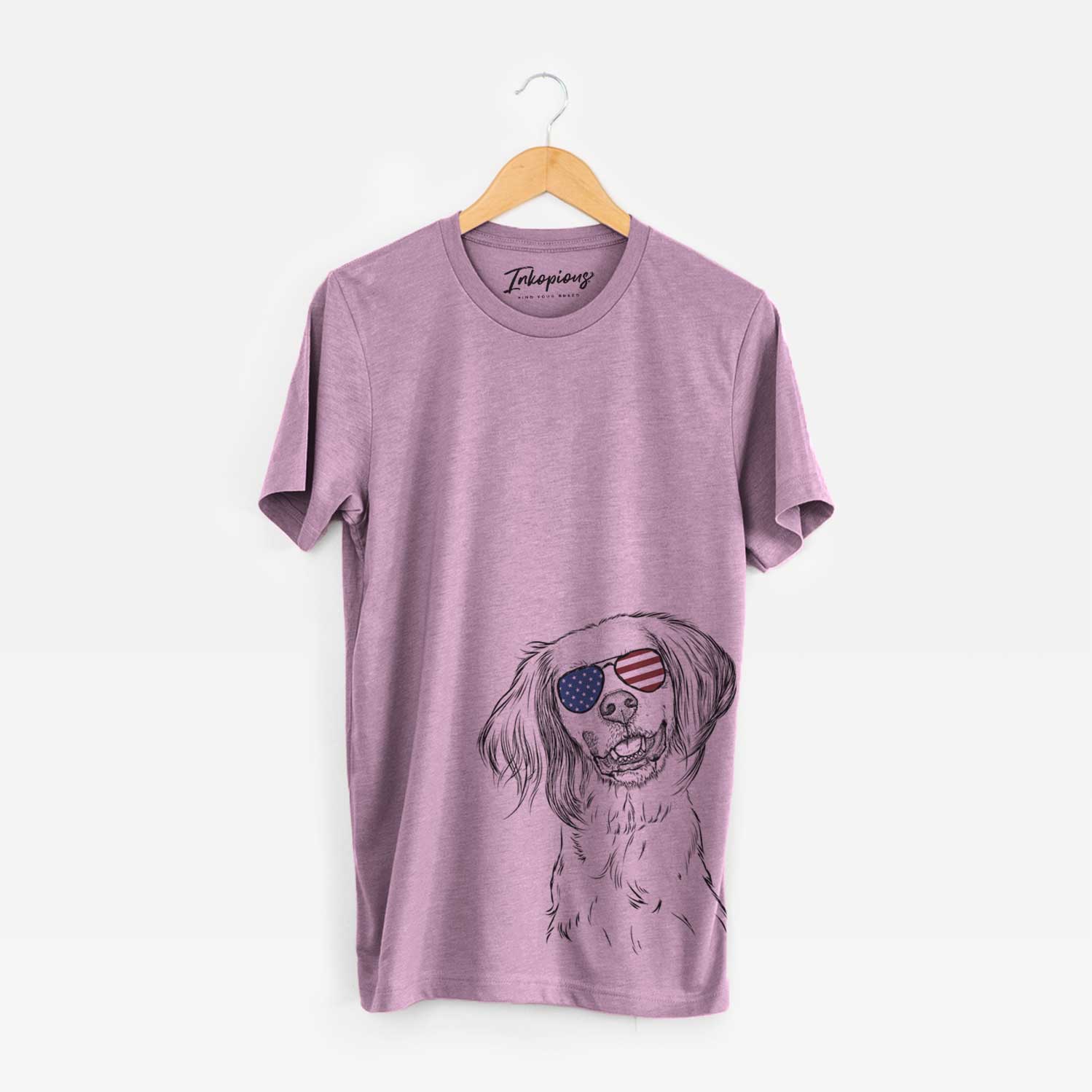Hand-drawn sketch of Cooper the English Setter wearing American flag sunglasses on an Orchid Unisex crewneck
