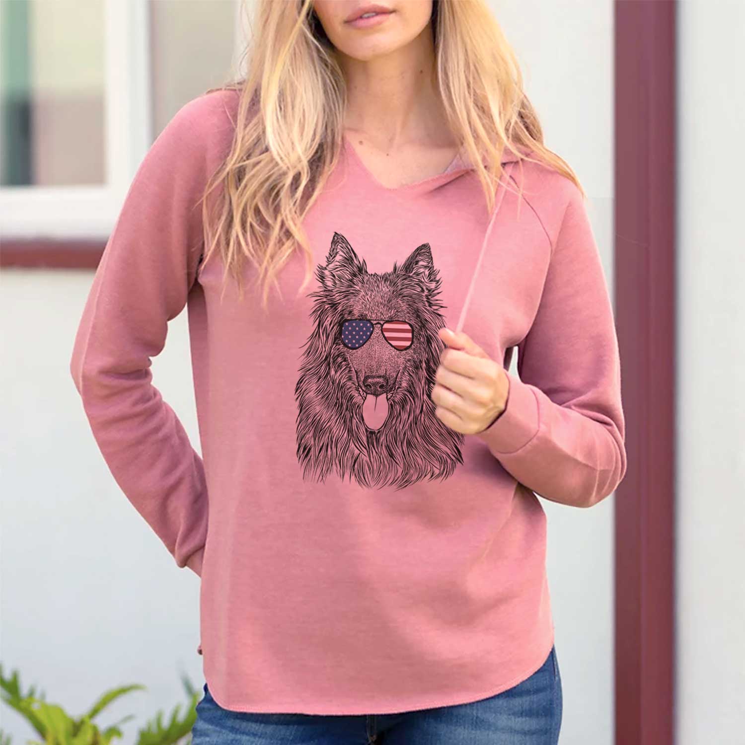 Hand-drawn sketch of Daan the Belgian Shepherd wearing American flag sunglasses on a Dusty Rose Cali Wave Hooded Sweatshirt, lifestyle photo
