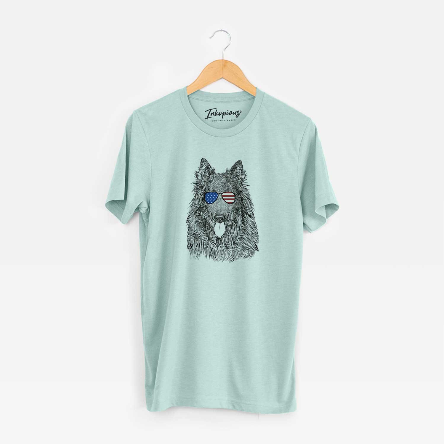 Hand-drawn sketch of Daan the Belgian Shepherd wearing American flag sunglasses on a Heather Sage Unisex crewneck