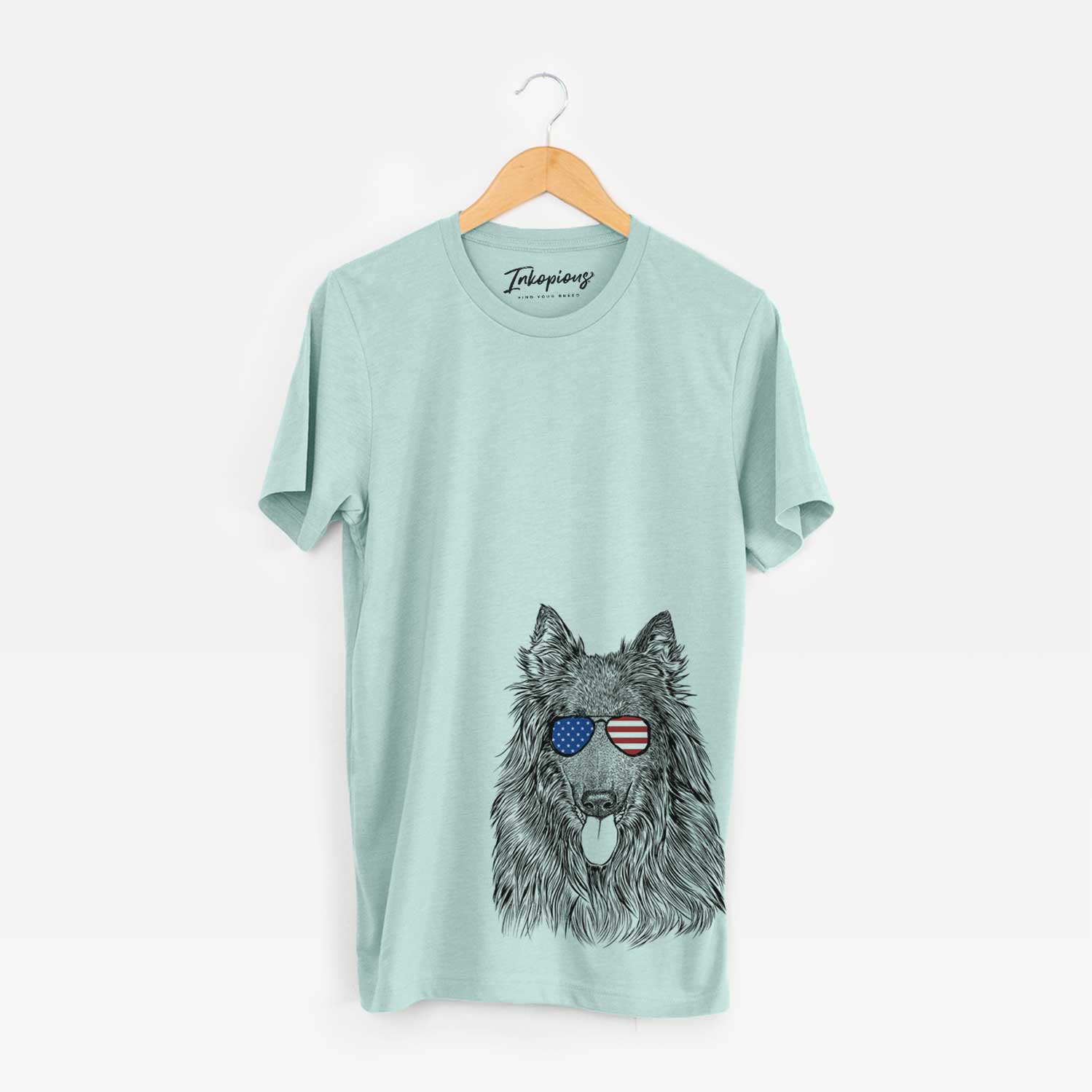 Hand-drawn sketch of Daan the Belgian Shepherd wearing American flag sunglasses on a Heather Sage Unisex crewneck
