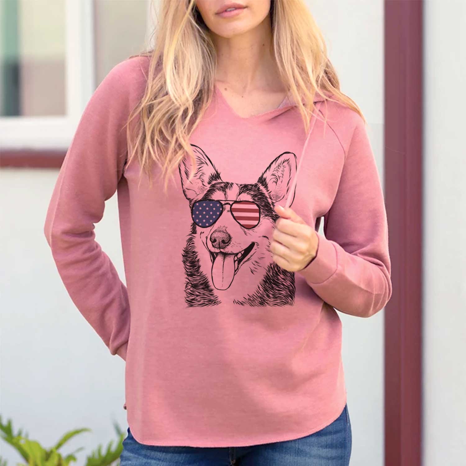 Hand-drawn sketch of Darma the Corgi wearing American flag sunglasses on a Dusty Rose Cali Wave Hooded Sweatshirt, lifestyle photo